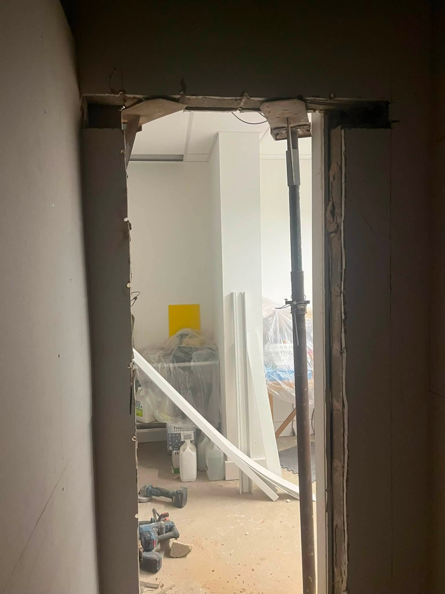 Newly formed doorway opening through to the adjoining room