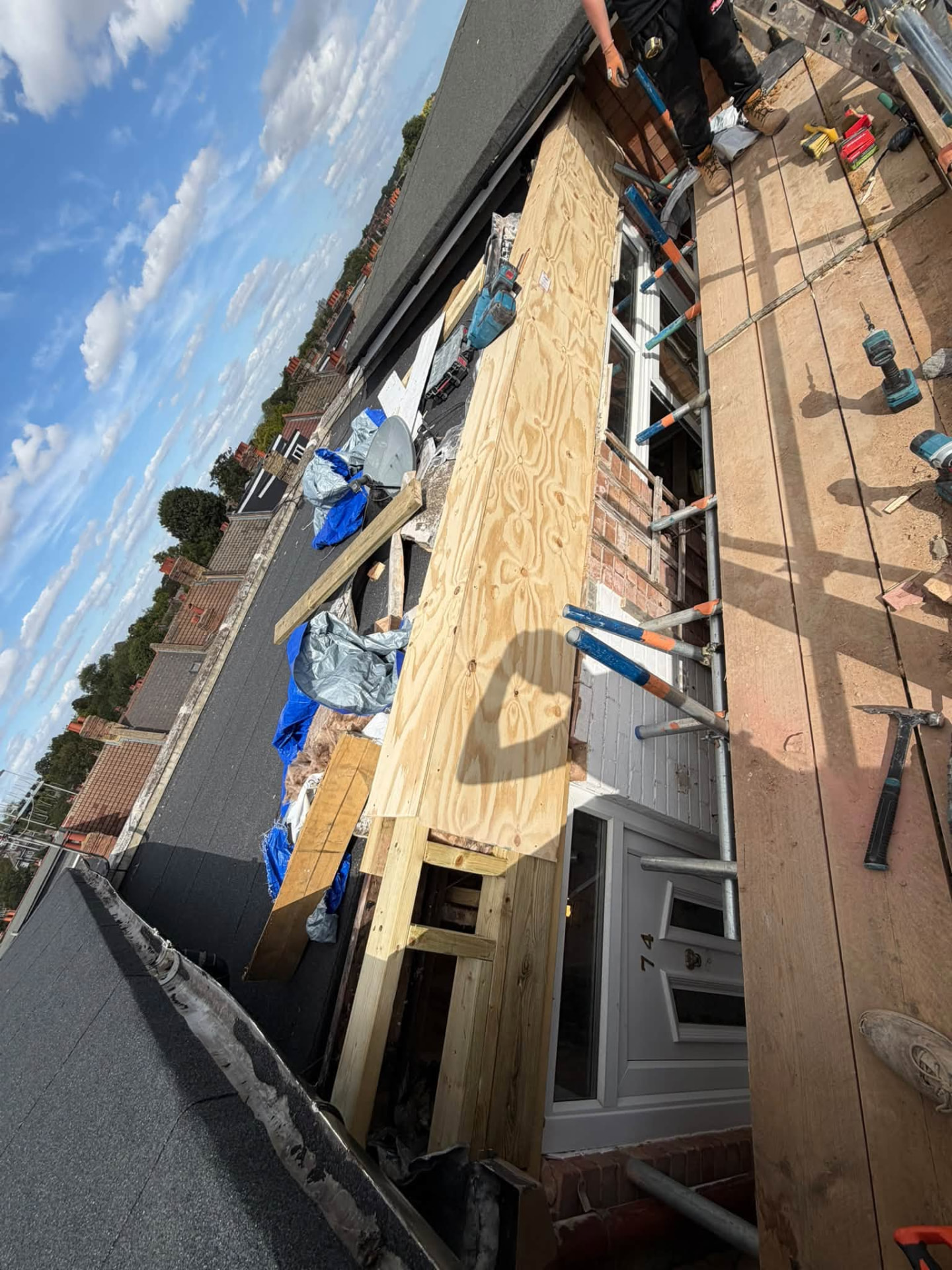 Plywood cladding installed to the front elevation during the rebuild