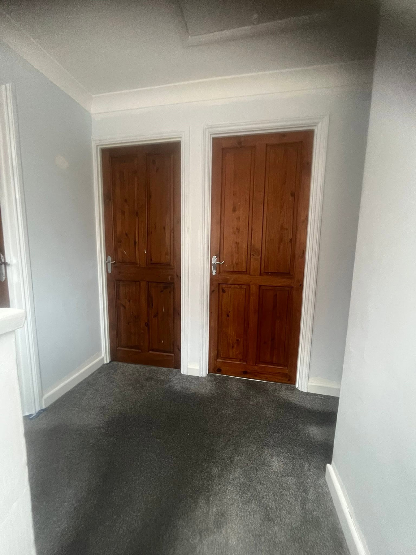 Two dated pine doors on the upstairs landing