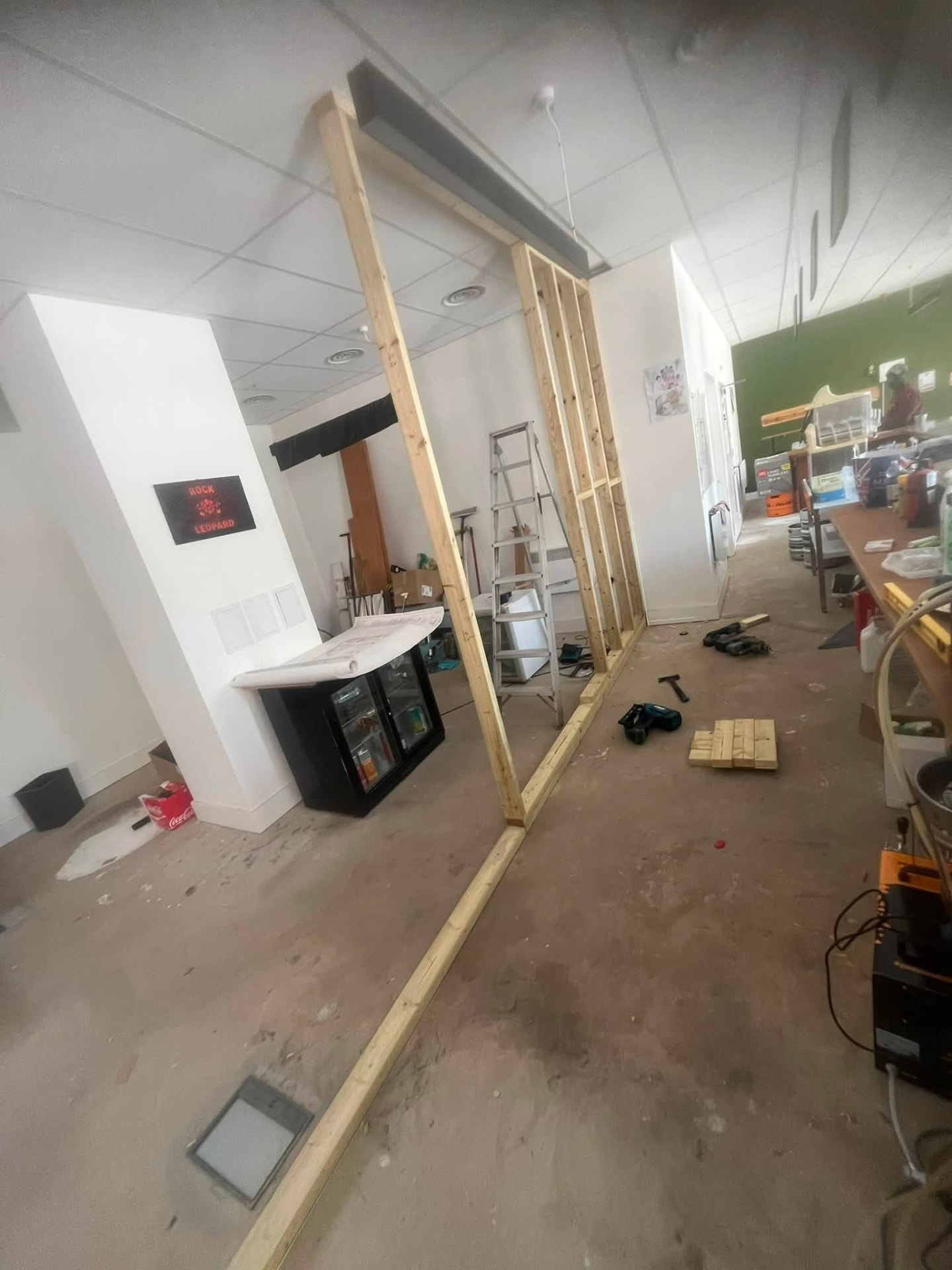 Commercial interior with timber sole plate laid out for new partition framing
