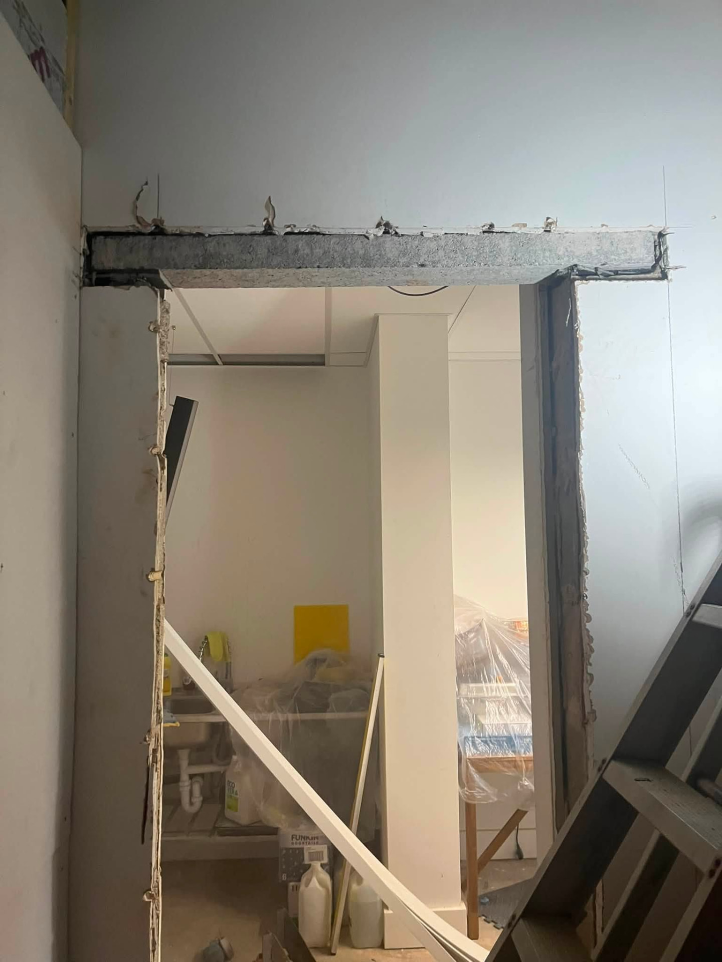 New structural opening formed with concrete lintel installed above