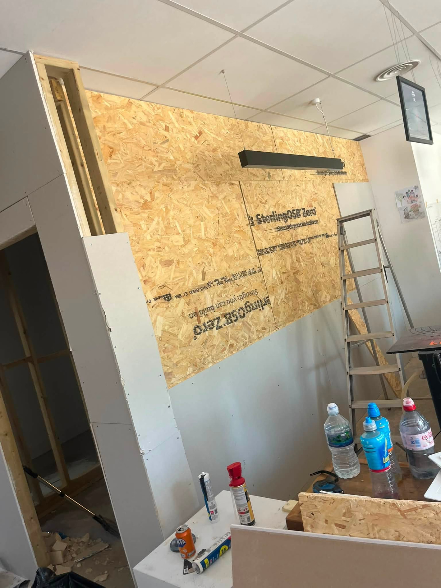 OSB and plasterboard cladding fixed to the new feature wall