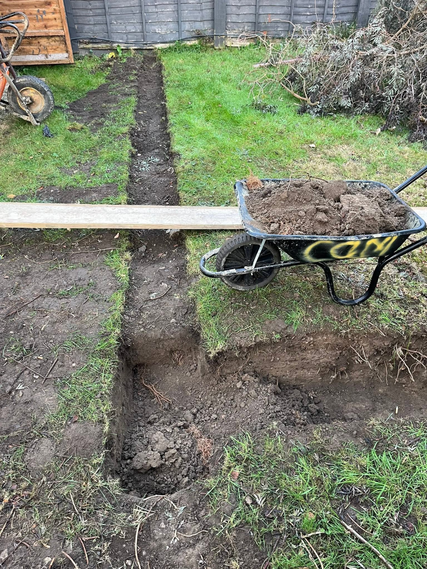 Garden marked out and trenches dug ready for new underground drainage