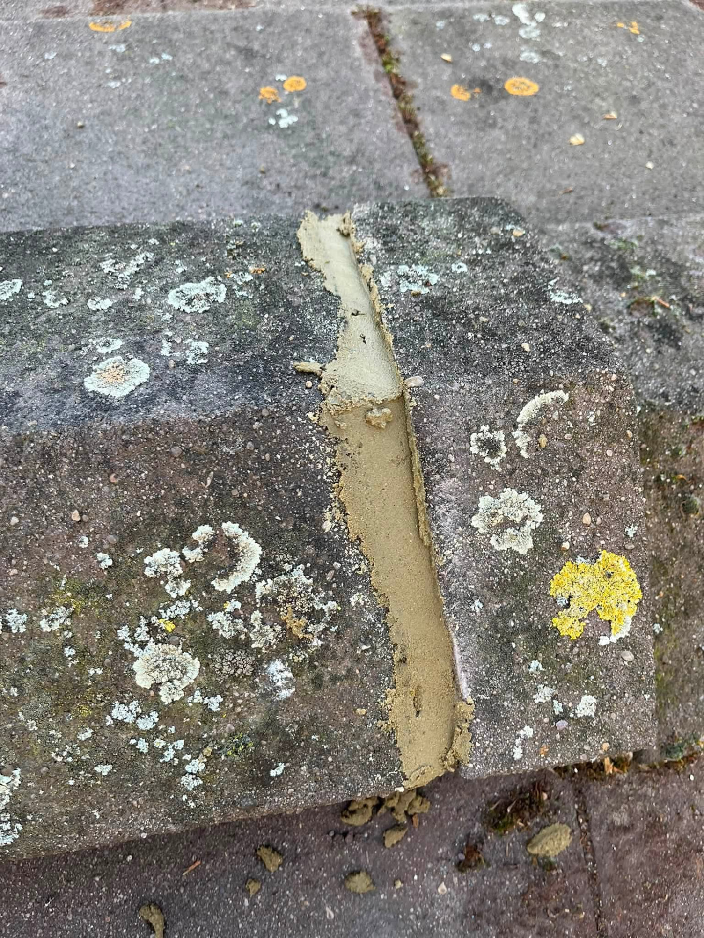 Ridge tile joint repointed with fresh mortar and made good