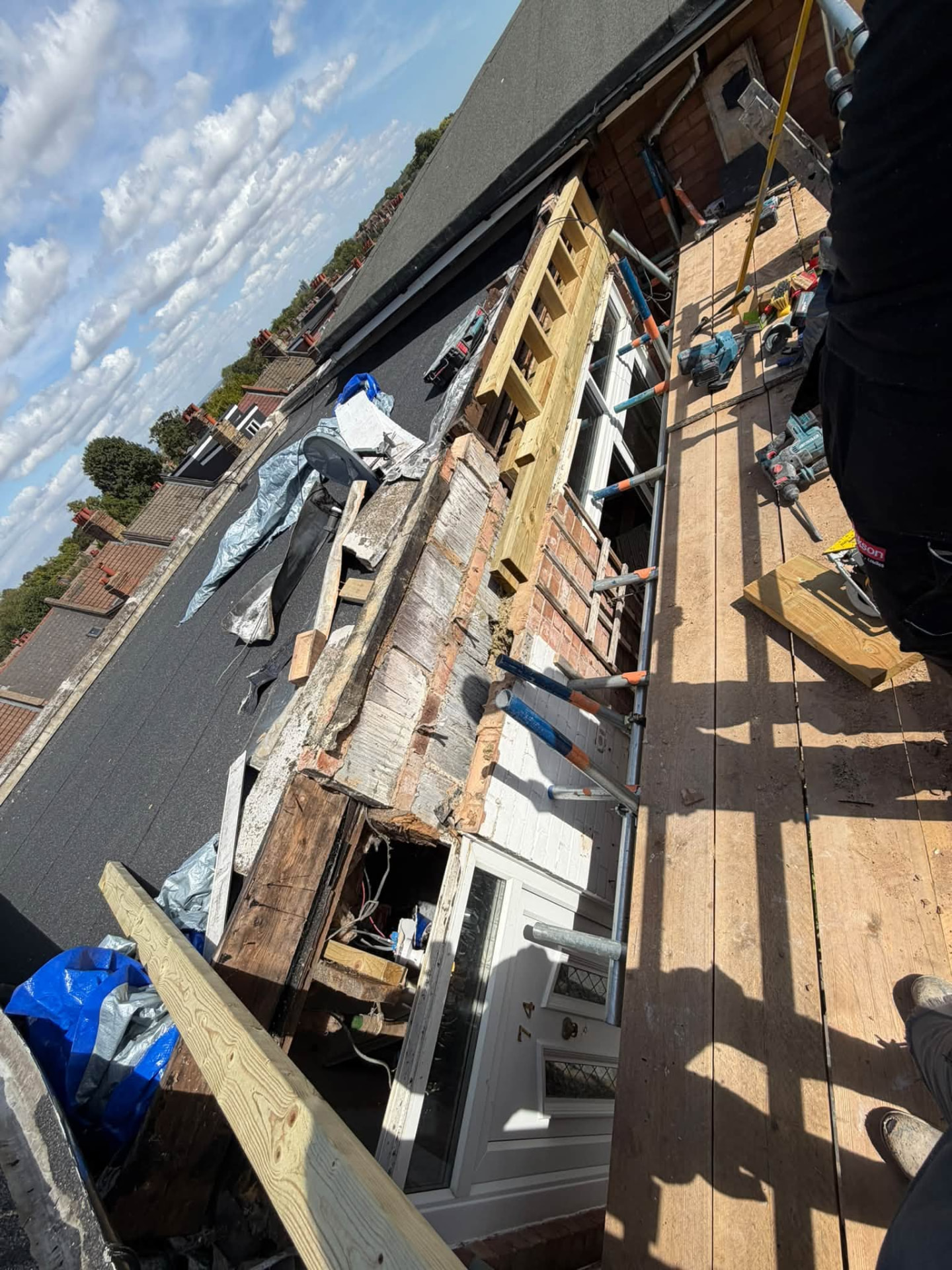 Front elevation from the scaffold with new timber framing installed above the entrance