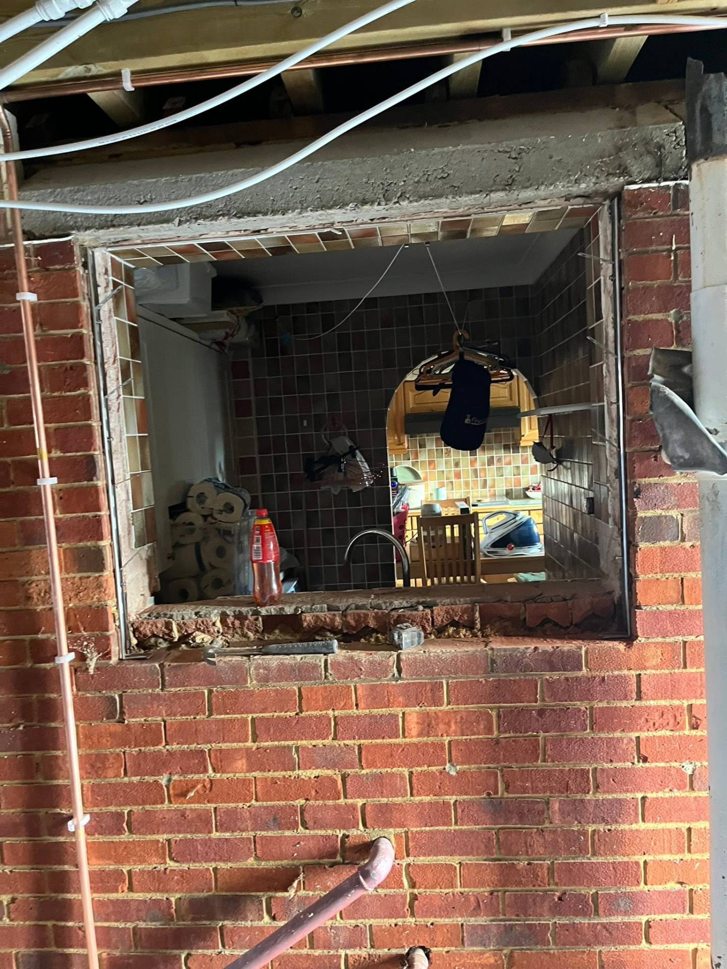Second old window opening removed showing the tiled reveal and exposed brickwork