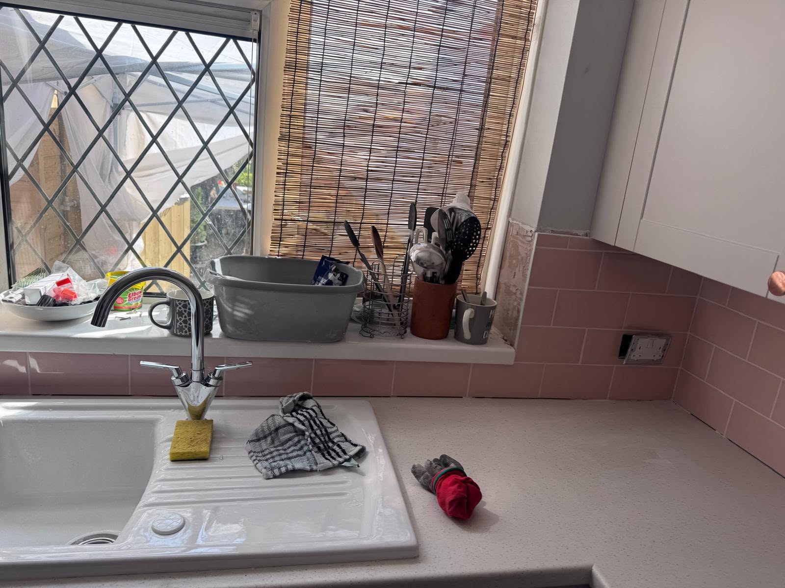 Finished tiling beside the kitchen window and sink
