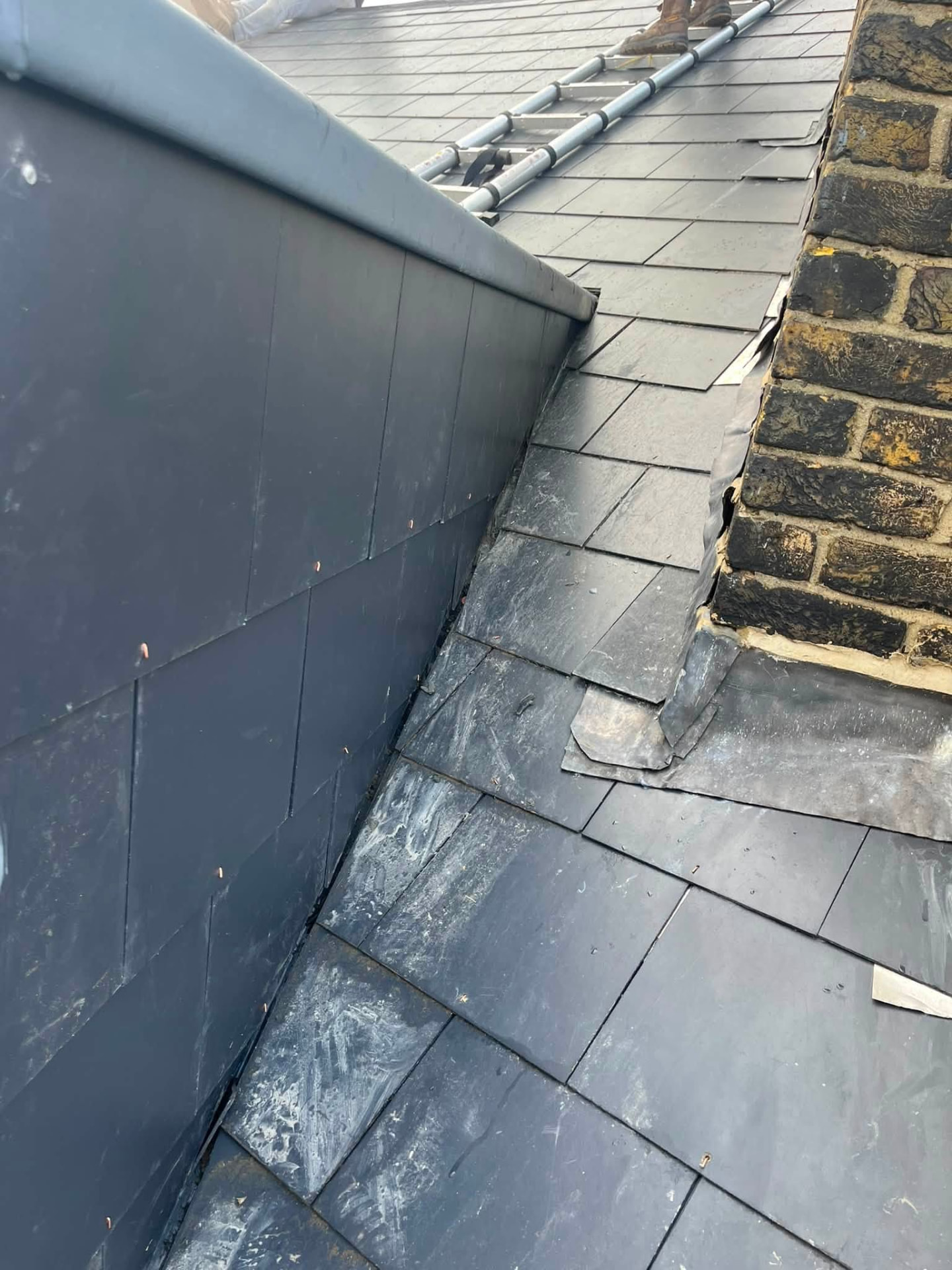 Finished roof with new slates, lead work and liquid rubber system fully protected