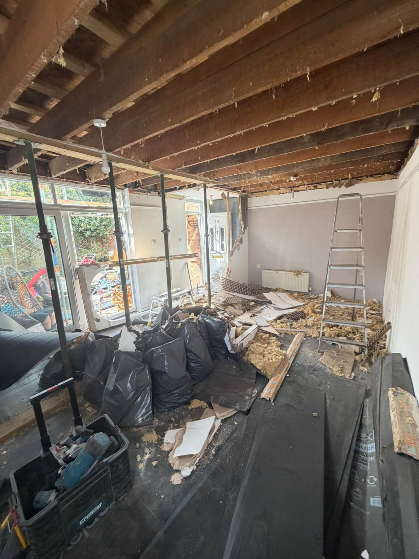 Ceiling stripped back exposing timber joists during the structural repair phase