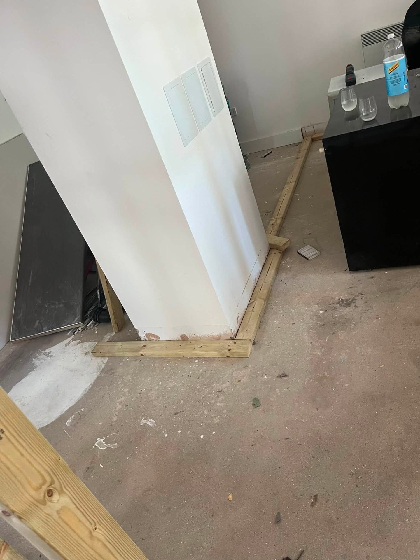 Close-up of timber sole plate fixed to the floor at a partition corner