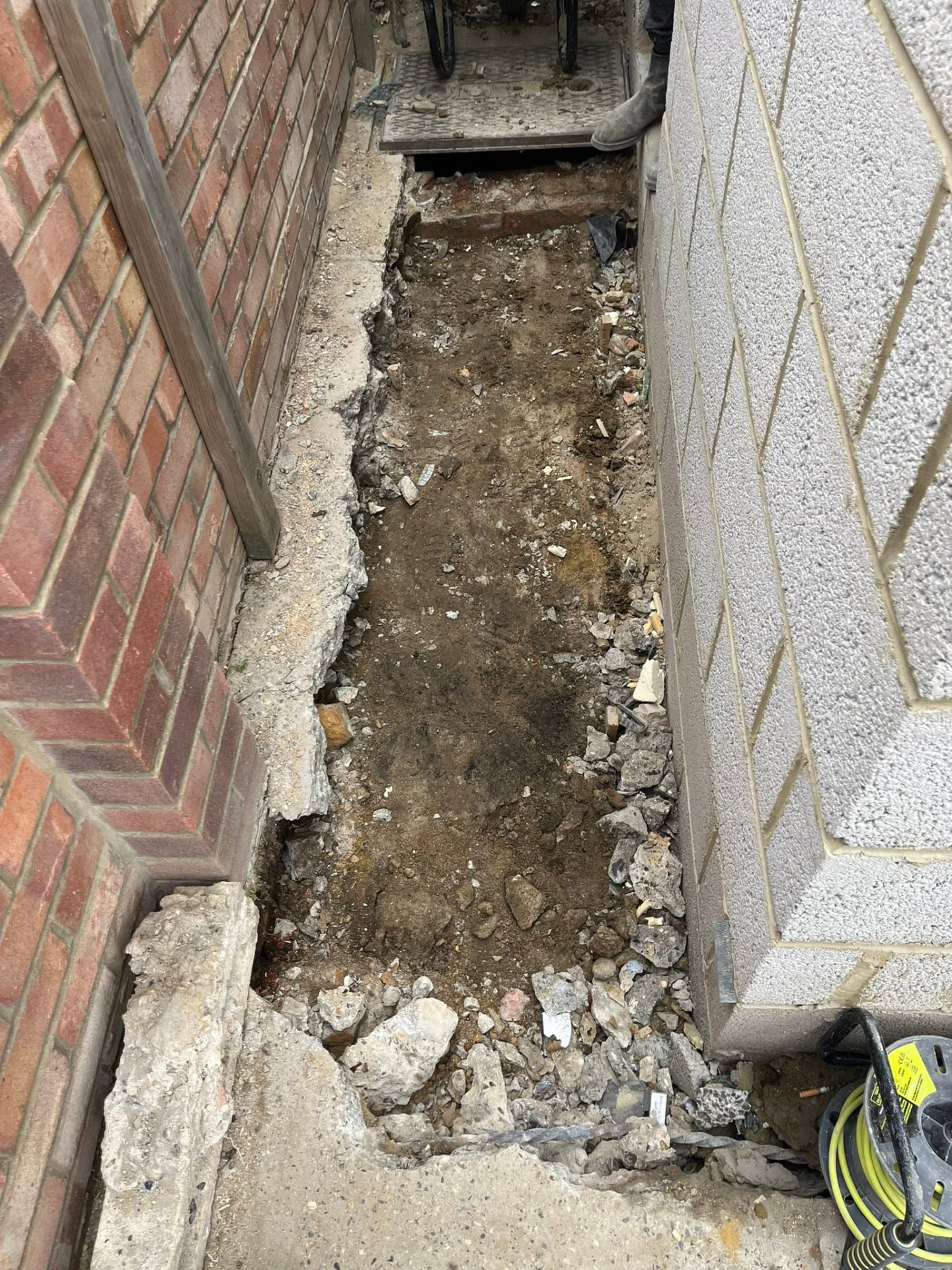 Concrete removed and the trench line exposed down to bare ground
