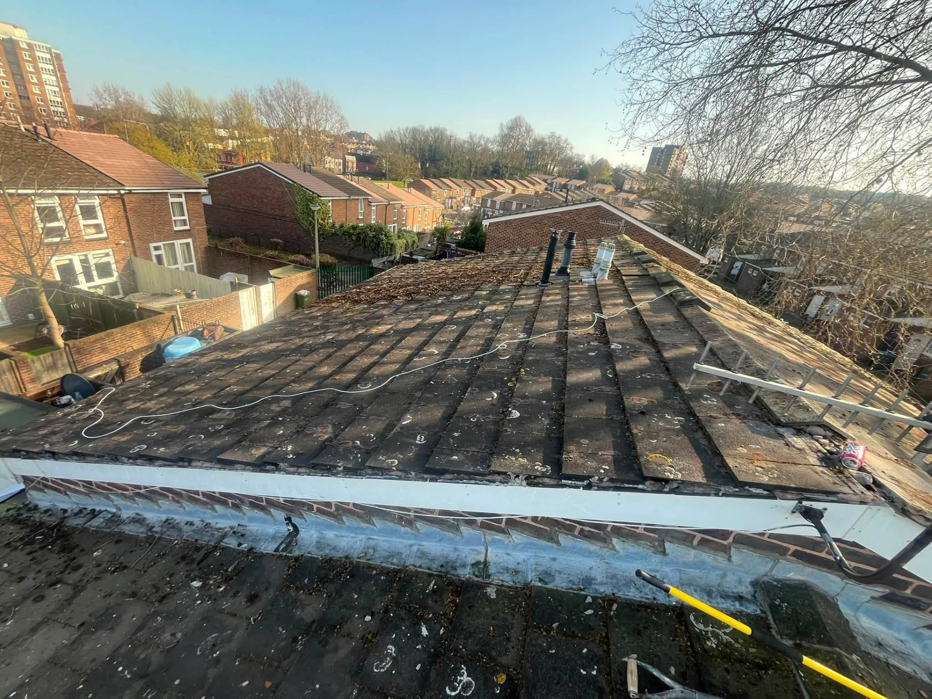 Cleared roof slope with edge and verge repaired after moss removal