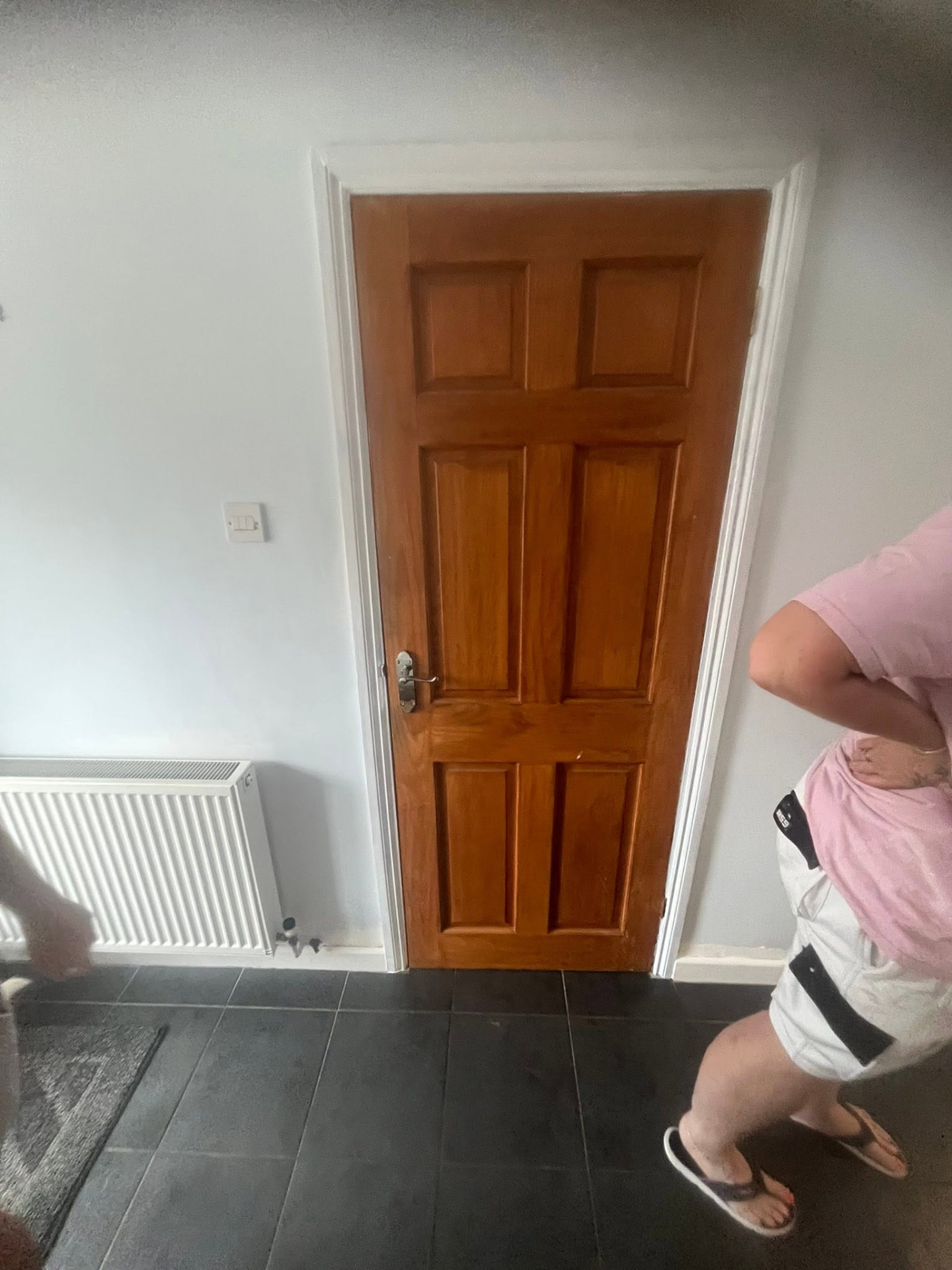 Old orange pine door in the hallway before being changed
