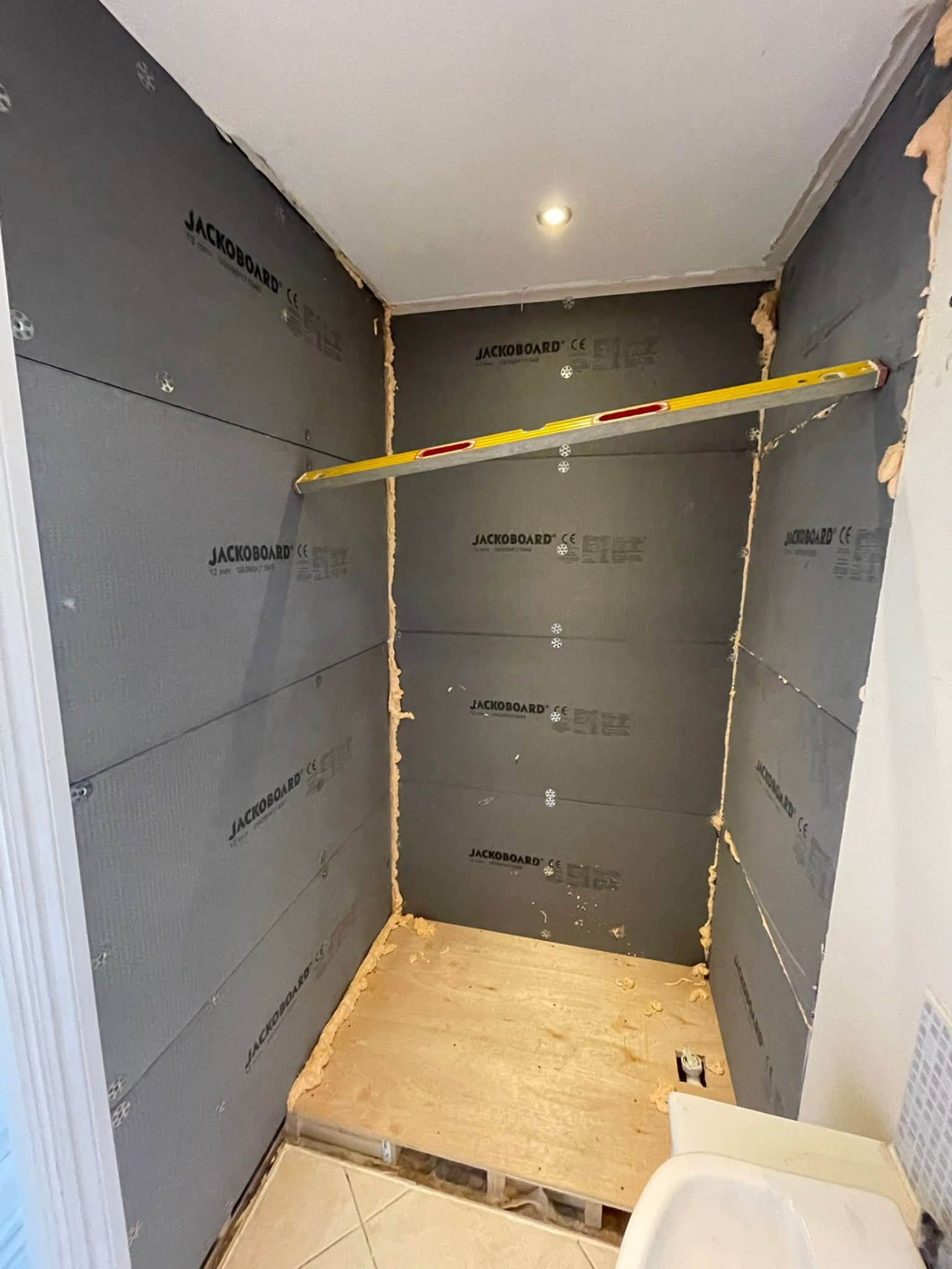 Shower cubicle boarded out with waterproof Jackoboard ready for tiling
