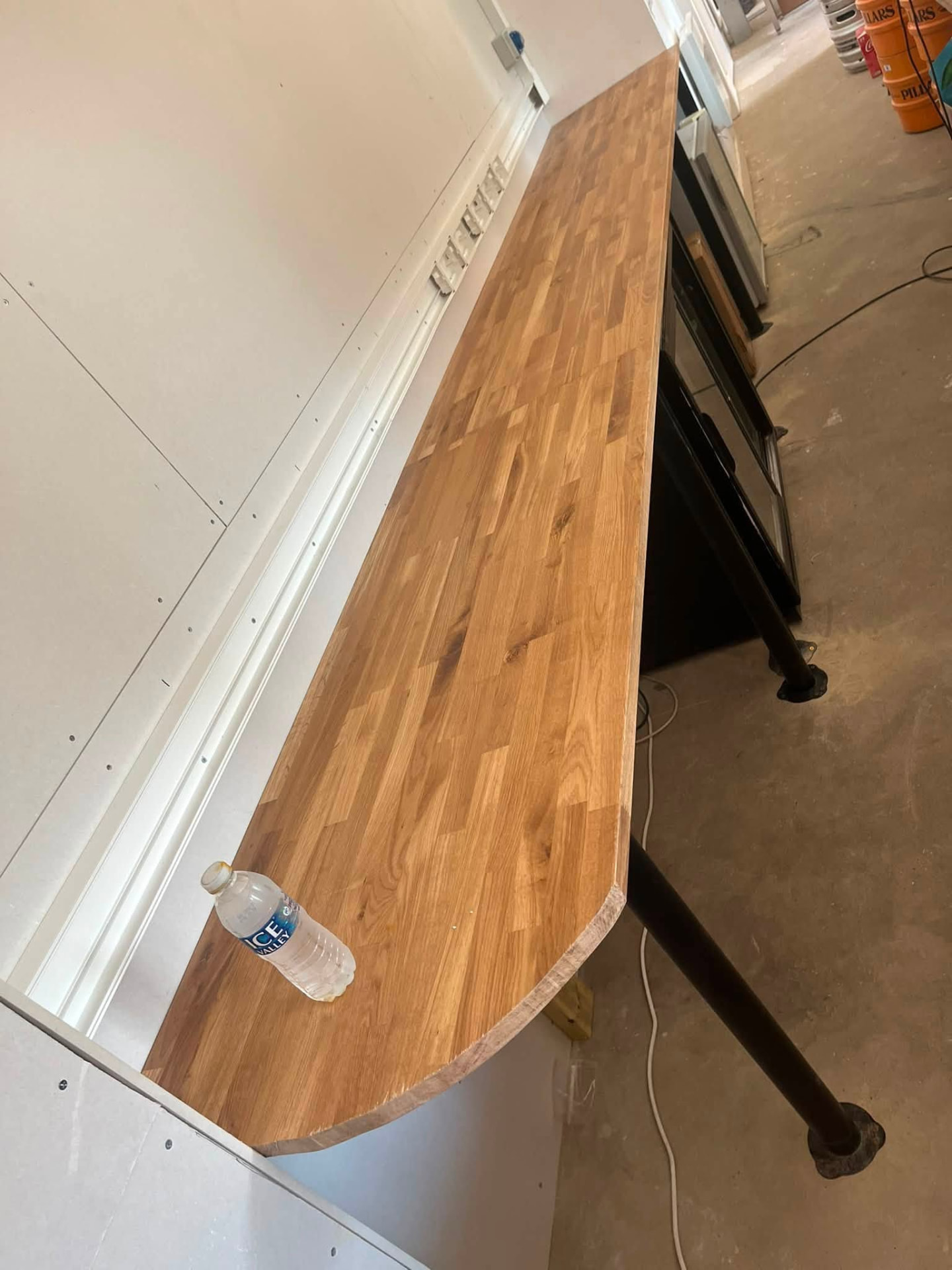 Solid oak bar top fitted with a curved end detail