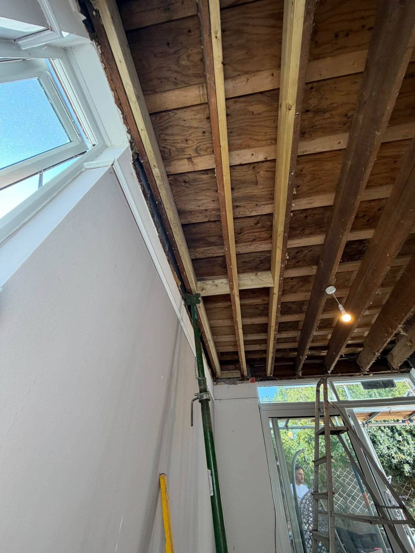 Ceiling opened up with new timber joists and props supporting the structure