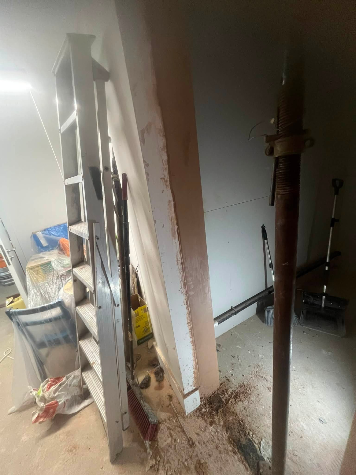 Freshly plastered reveal alongside the newly boarded store room
