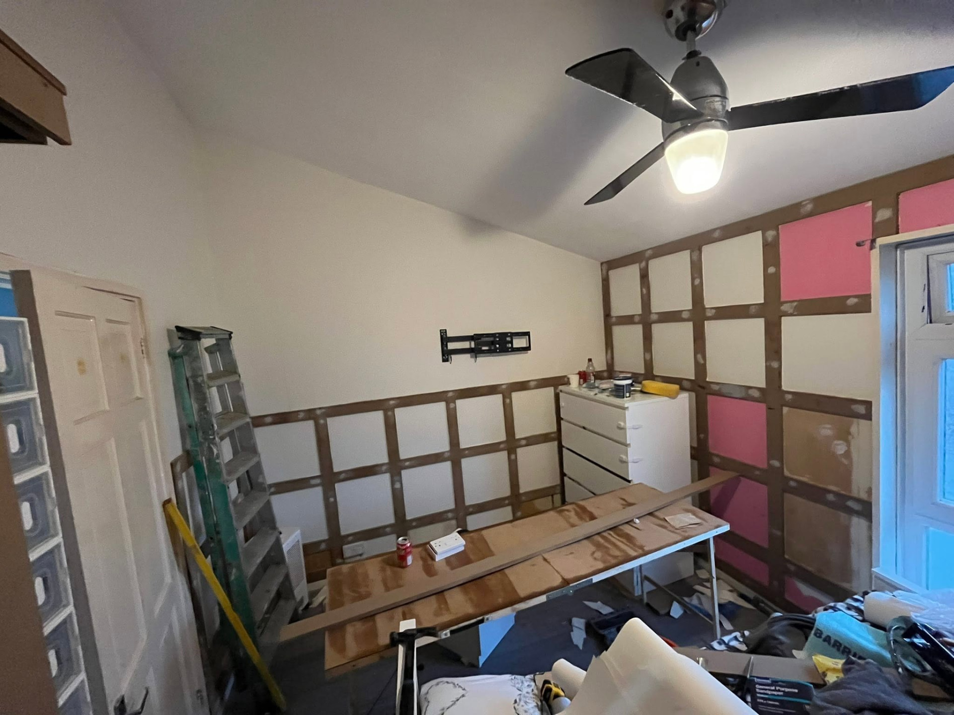 Bedroom mid-works with part-fitted panelling battens and filled joints