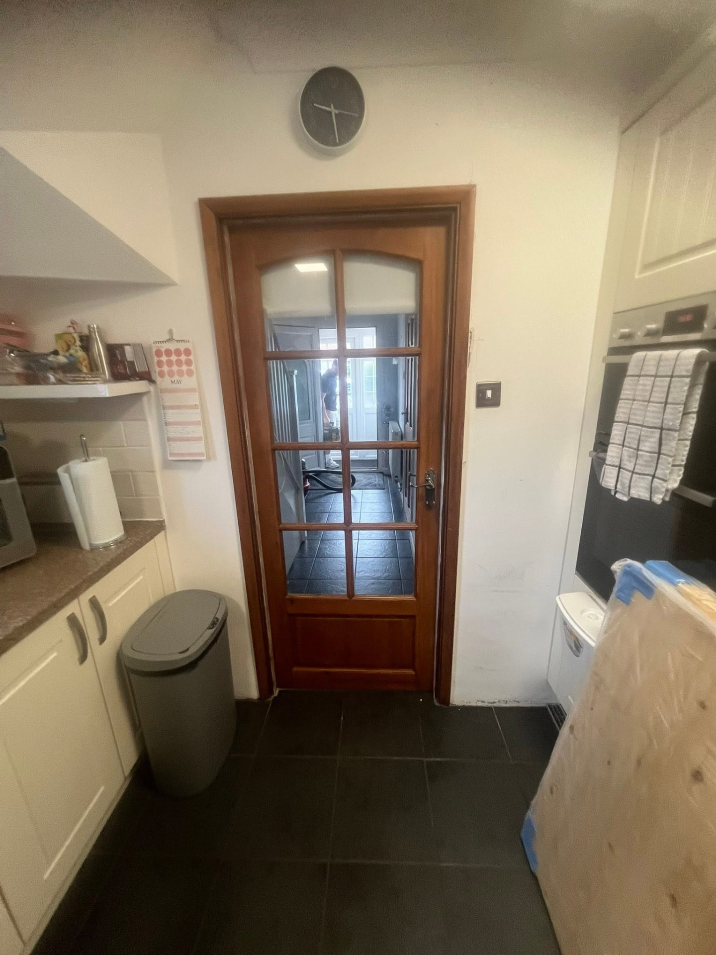 Glazed timber kitchen door before replacement
