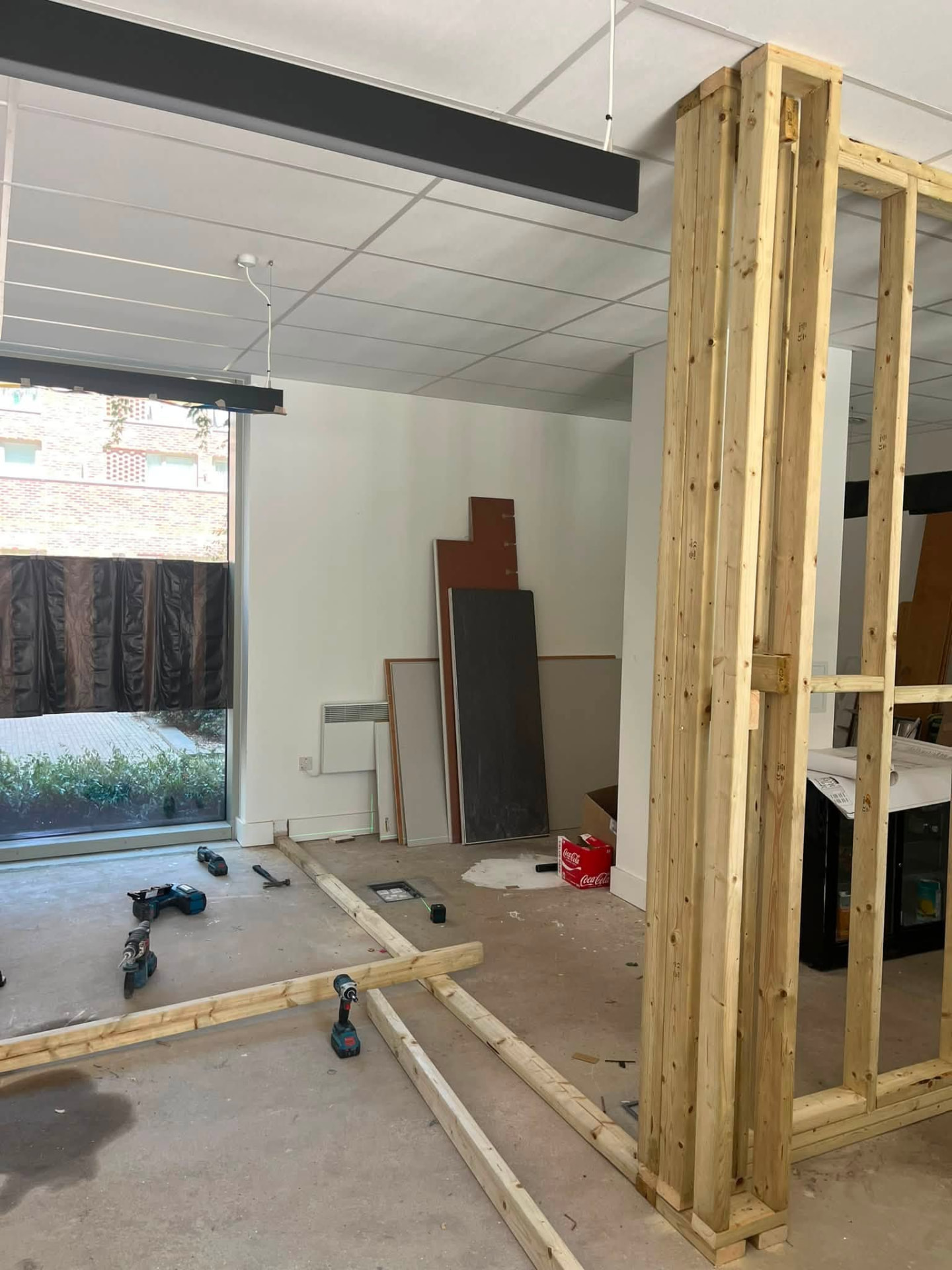 Second stud partition line started across the open plan area