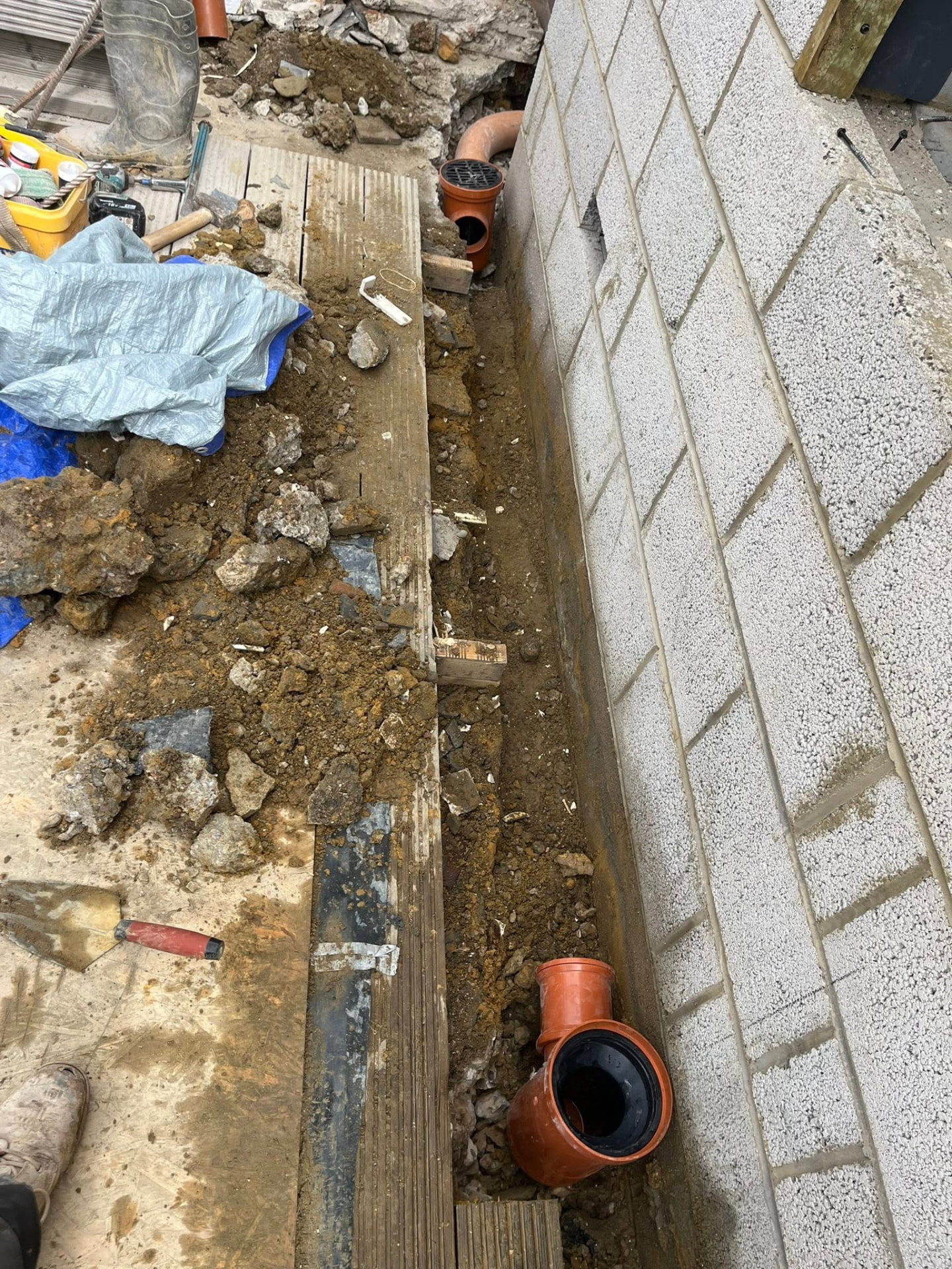 Pipe run extended along the wall with connections set for the sink waste