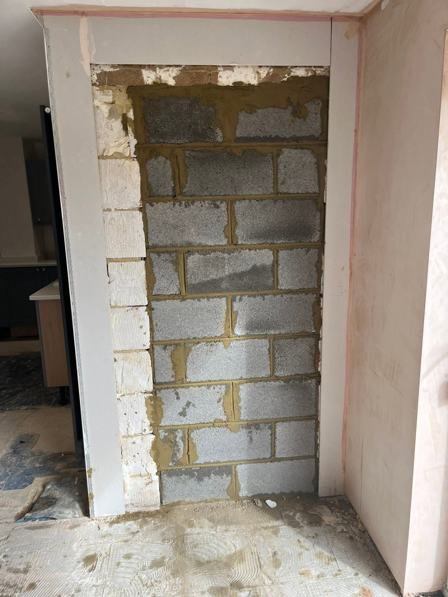 Second doorway opening blocked up with lightweight blocks, ready for finishing