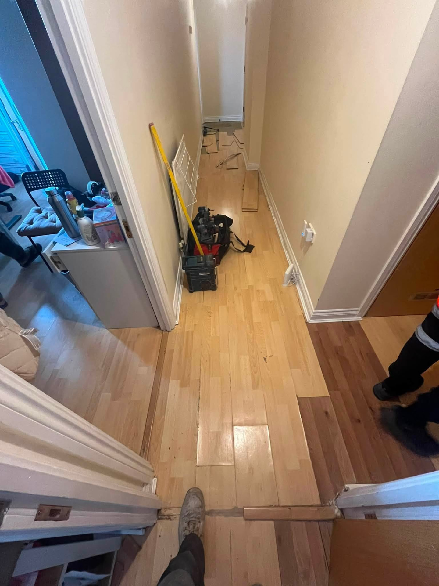 Hallway laminate flooring lifted ready for new underlay and boards