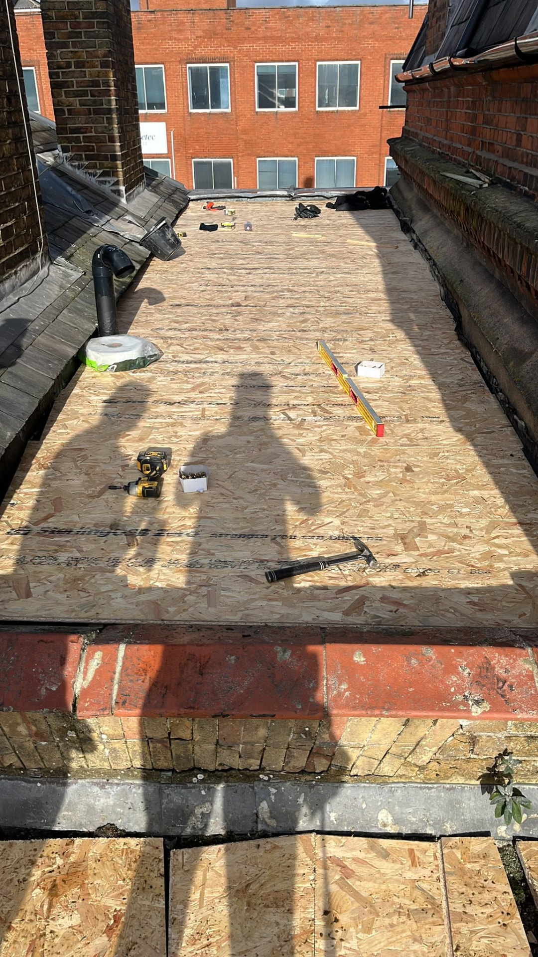 New OSB tongue and groove boards laid on furring pieces to create a fall