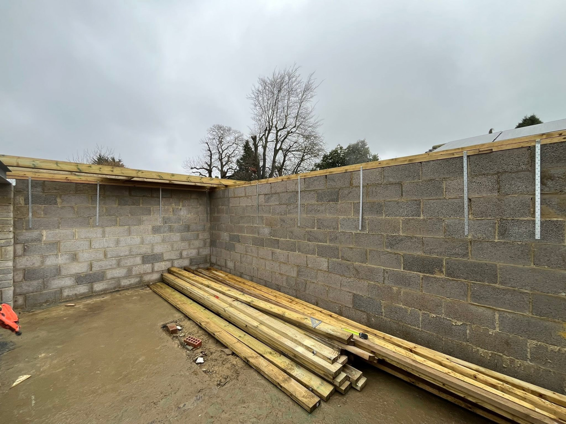 Blockwork walls with timber wall plate fixed around the perimeter