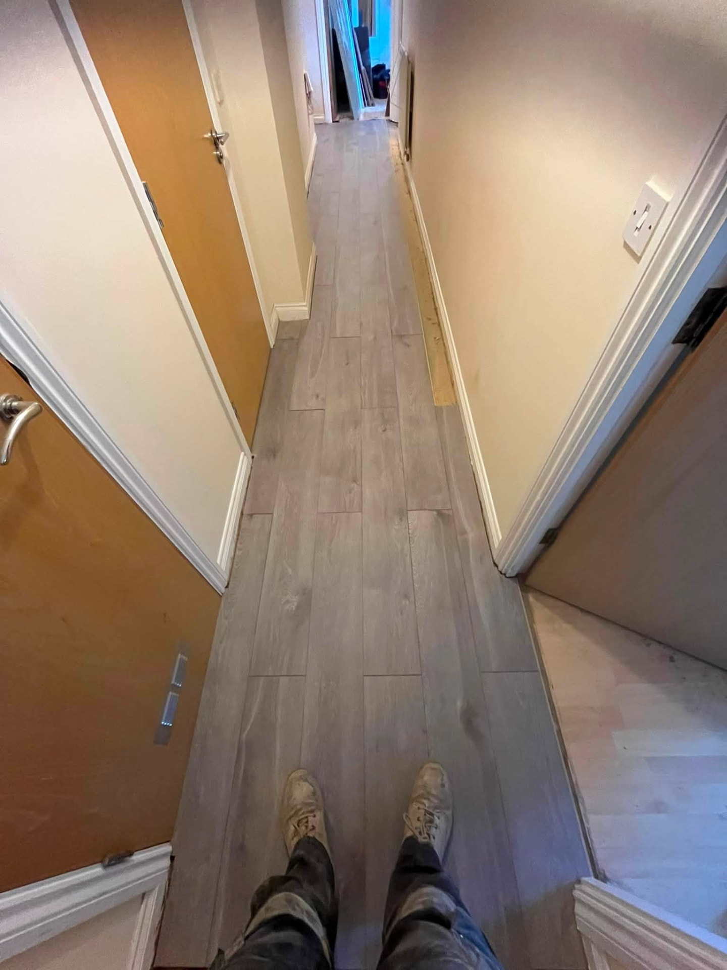 Completed hallway with new 12mm grey oak laminate flooring