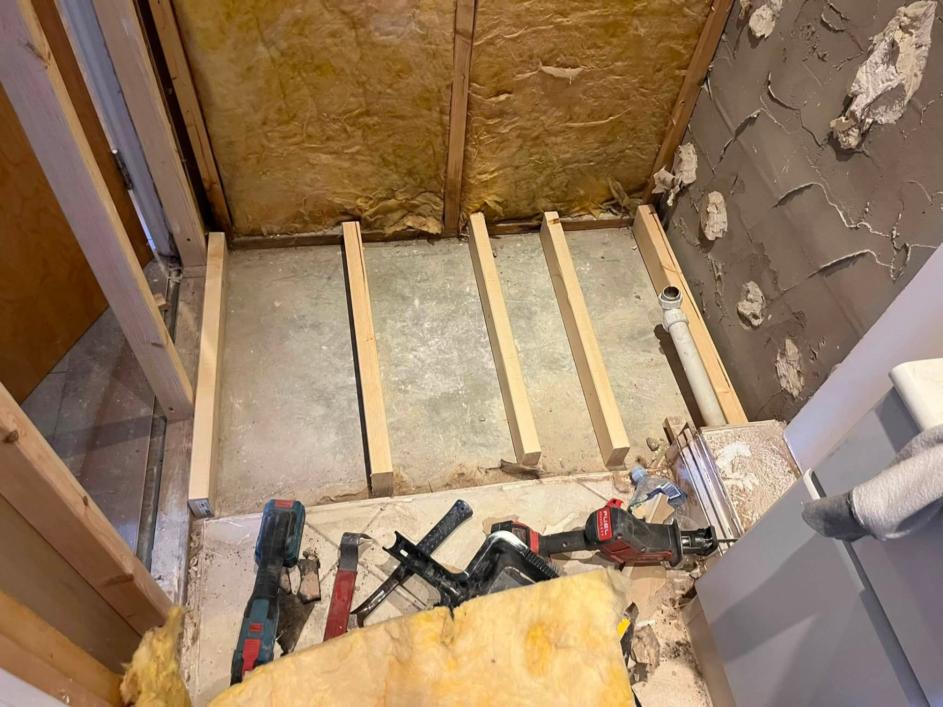 New timber battens fixed to the shower floor ready for the tray build-up