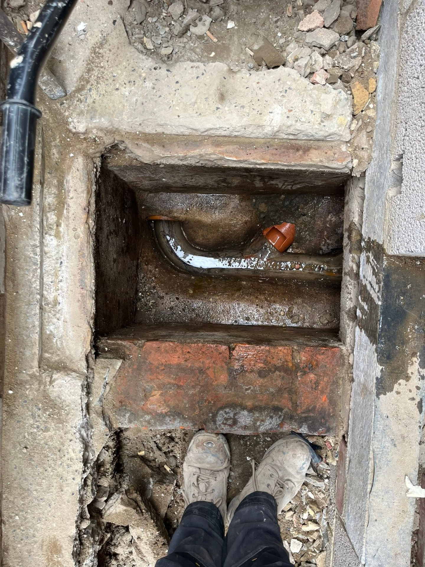 Existing brick chamber opened up ready for the new pipe connection