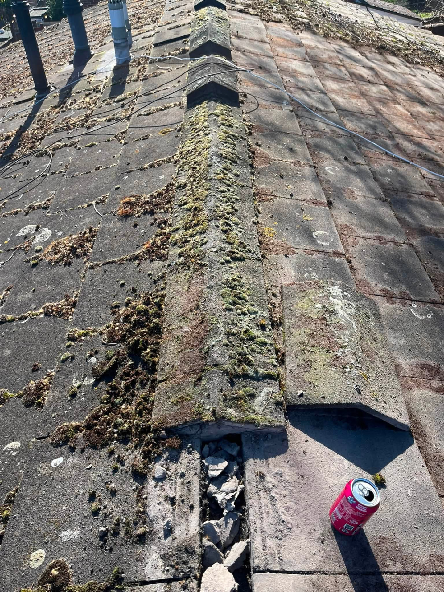 Ridge tiles inspected with broken mortar and cracked tiles identified