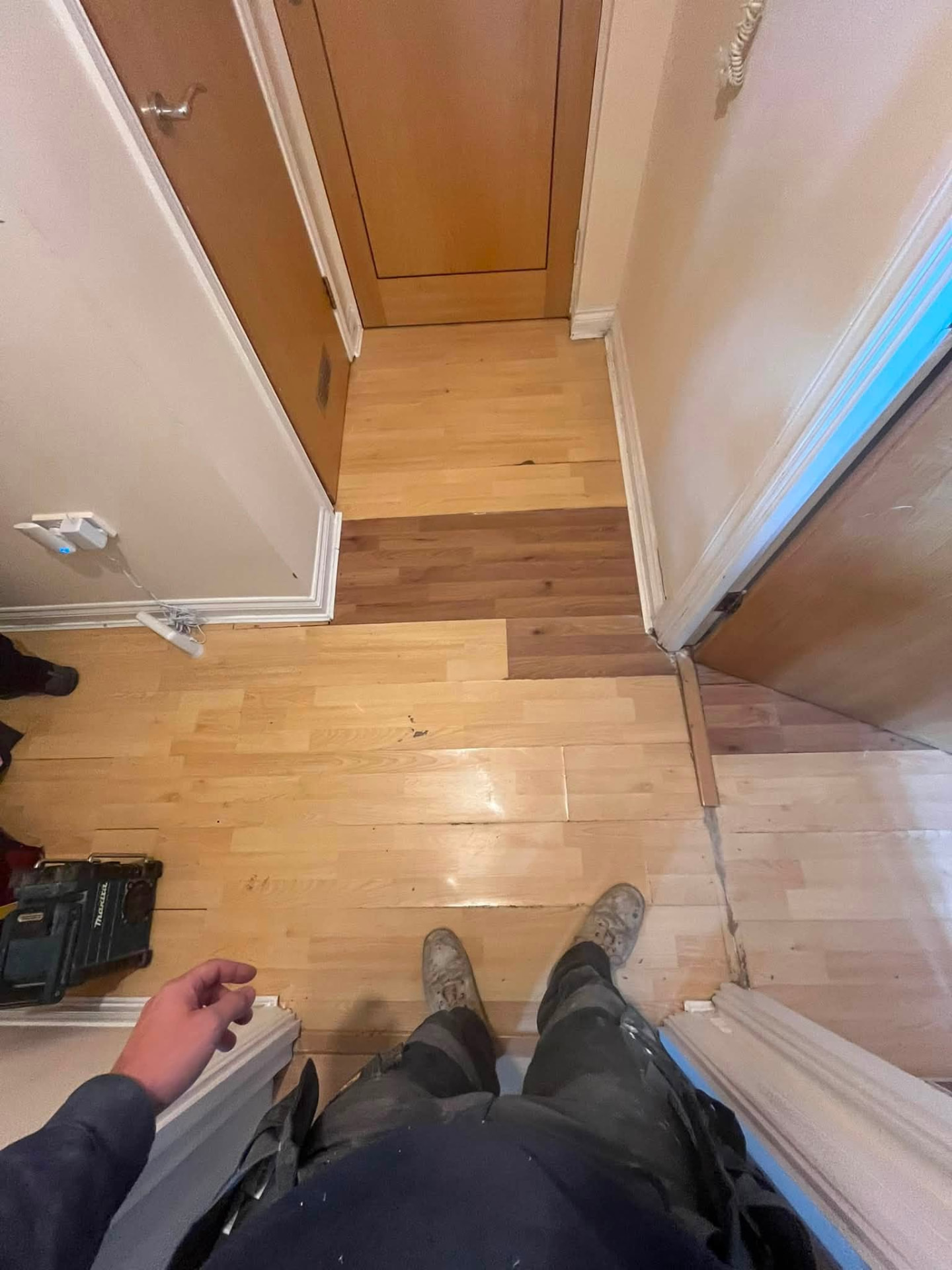 Flooring removed across the landing to reach the water damaged areas