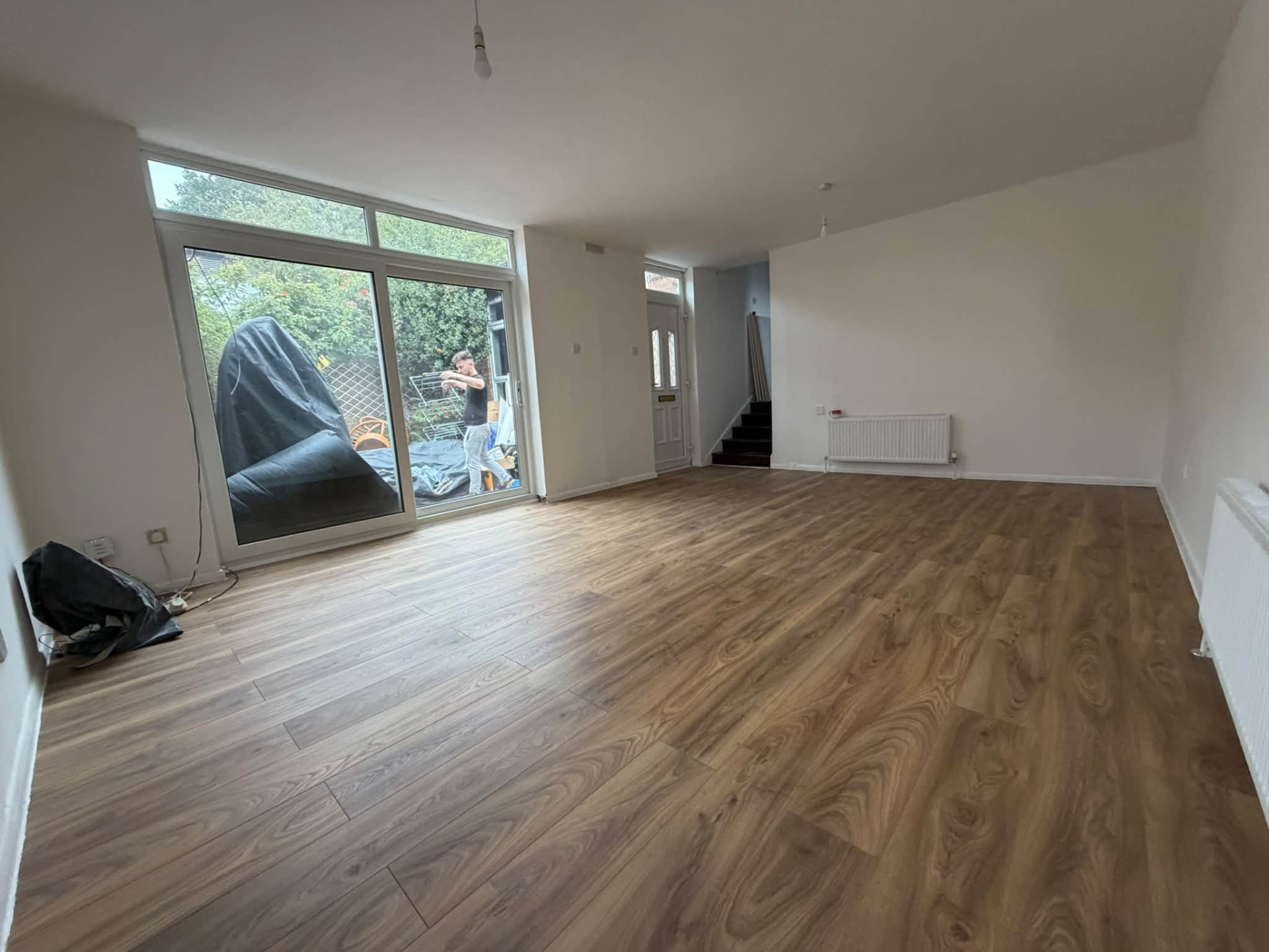 Newly laid laminate flooring in the bright, freshly decorated living space