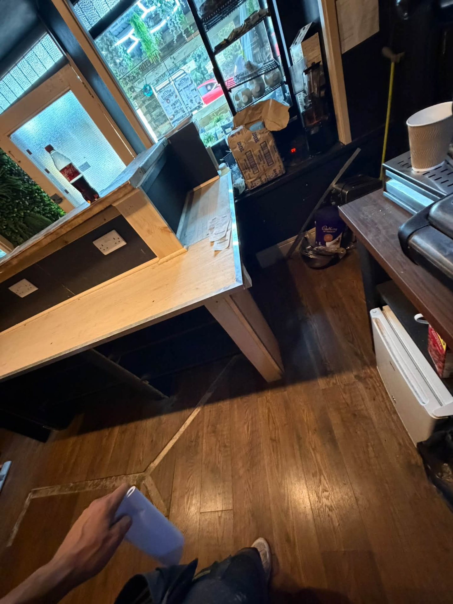 Front counter nearing completion with slatted panels and worktop installed