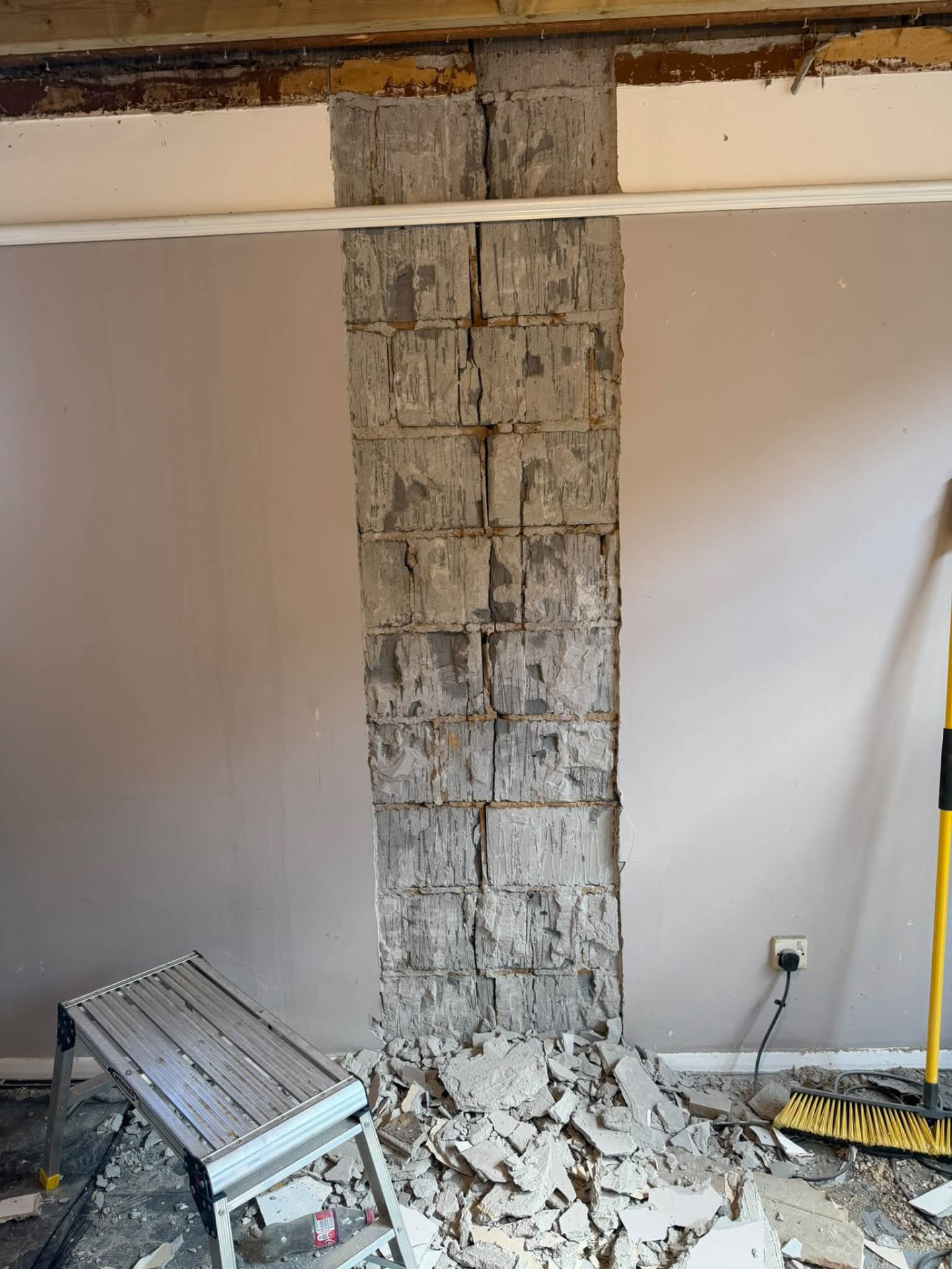 Full height of the damaged blockwork exposed for structural repair