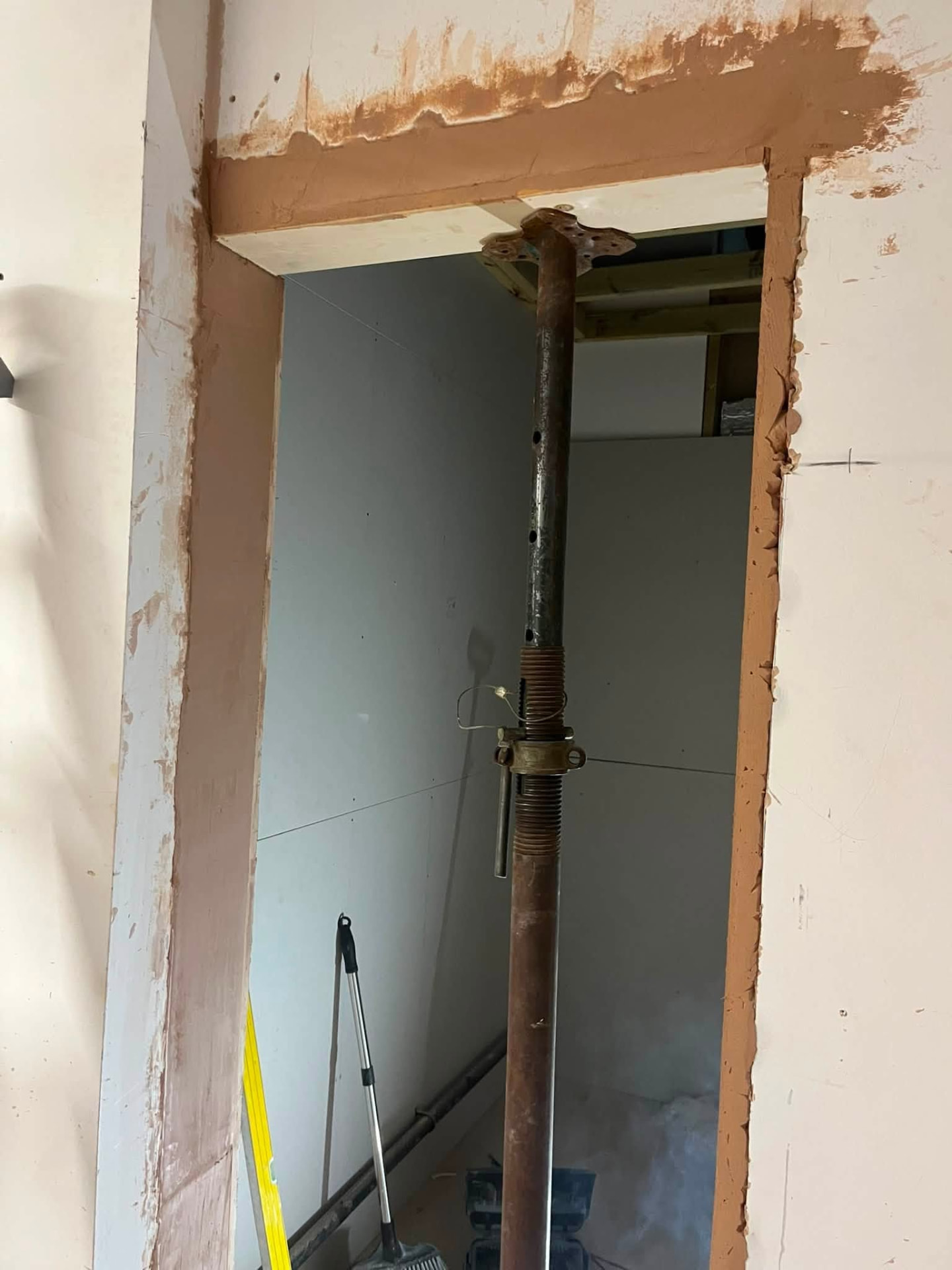 Doorway opening plastered around the reveals and lintel