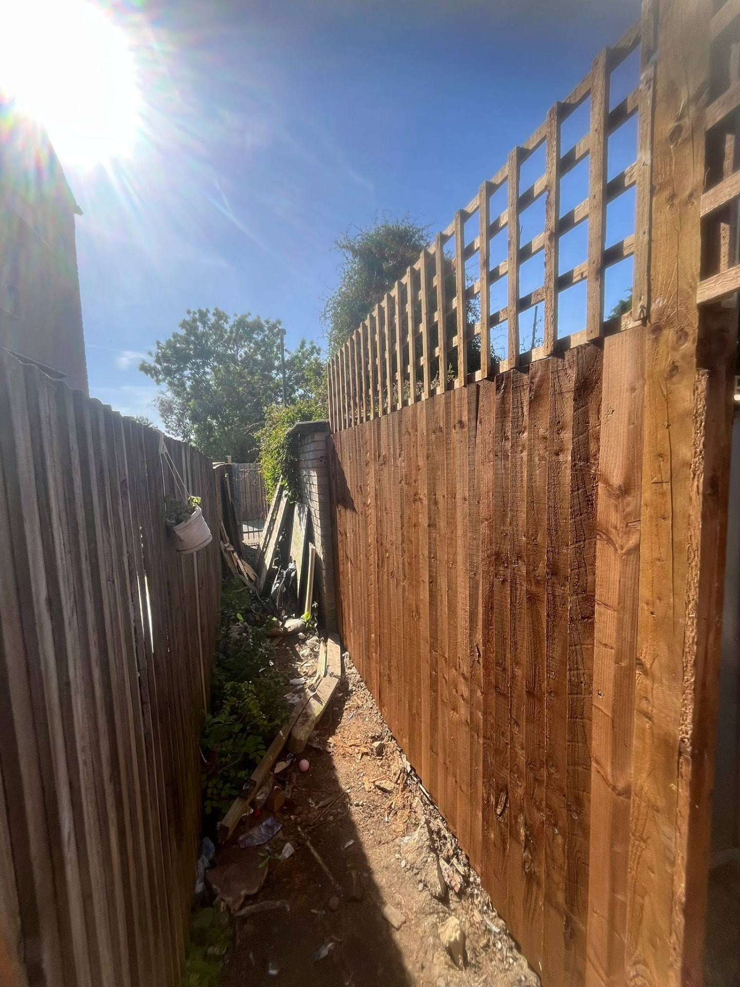 Completed 6.5ft pressure-treated fence topped with 2ft trellis