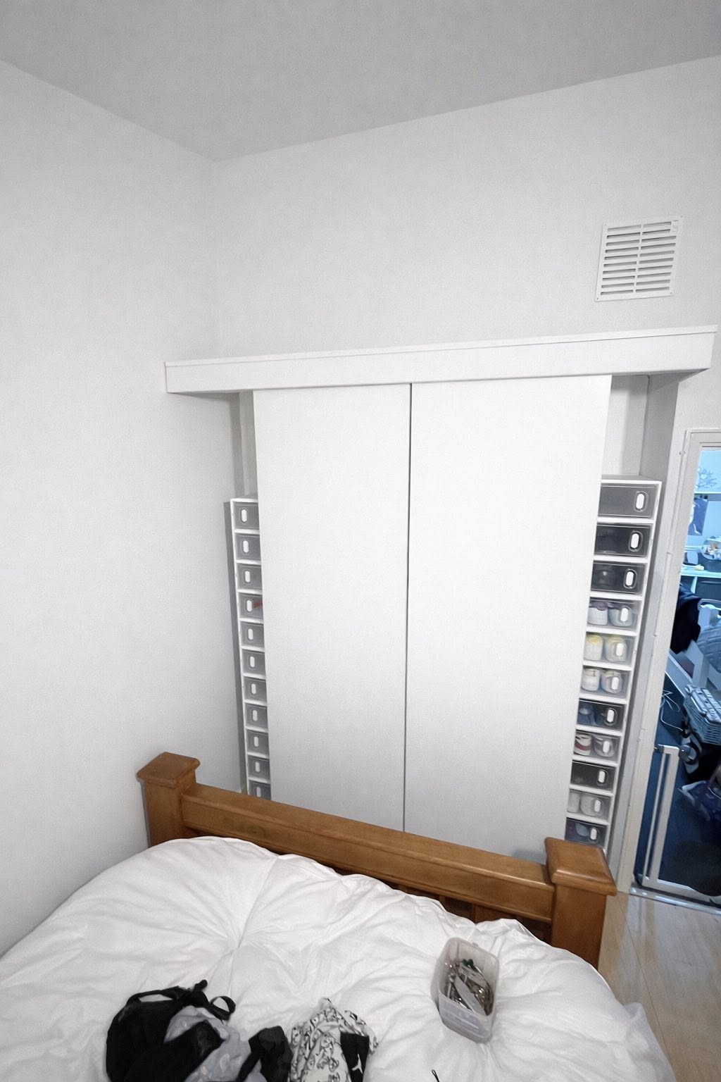 Wardrobe and surround repainted in a clean white finish
