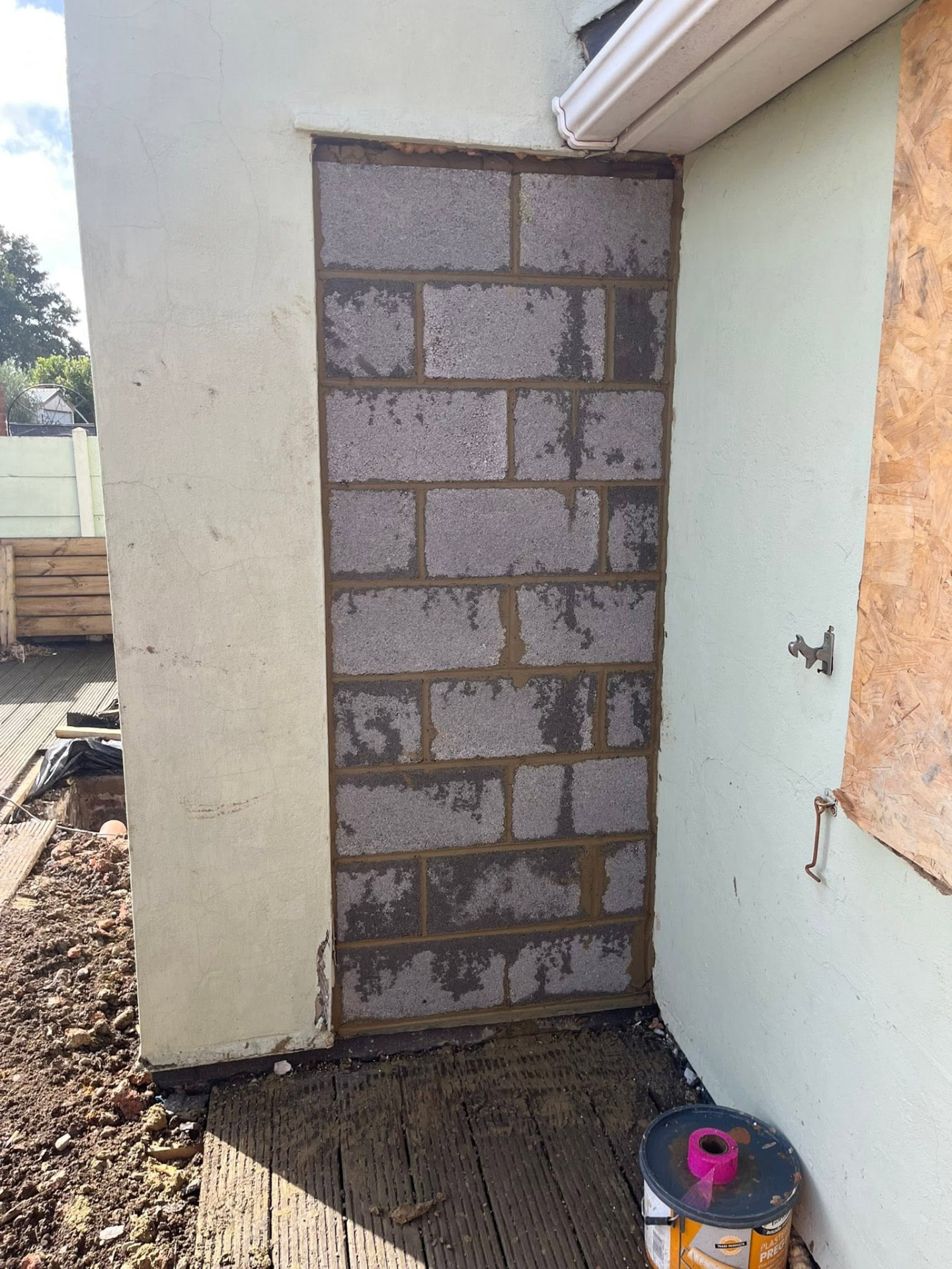 Old doorway neatly blocked up with lightweight blocks ready for rendering