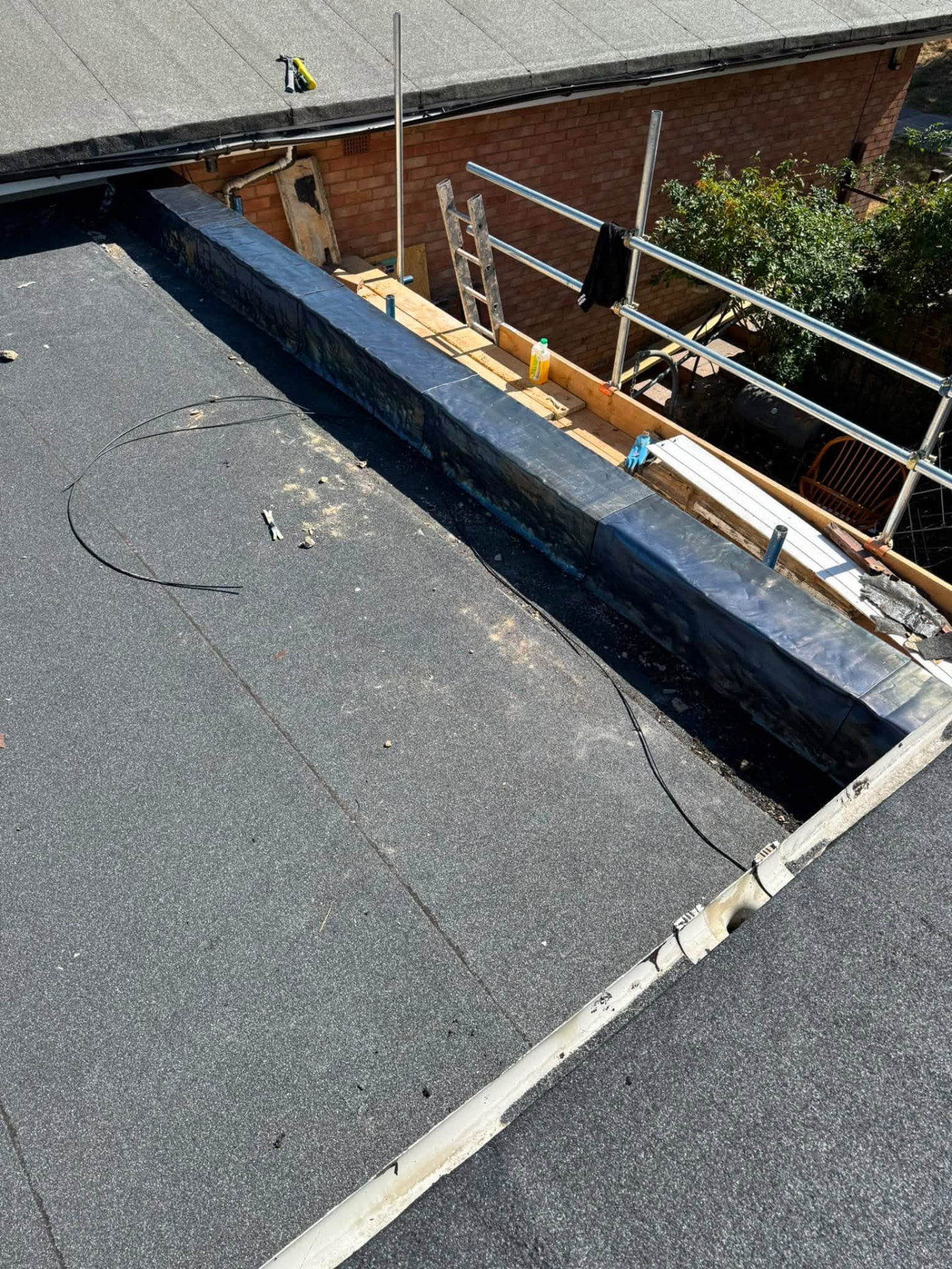New leadwork and flat roof covering installed along the rebuilt parapet wall