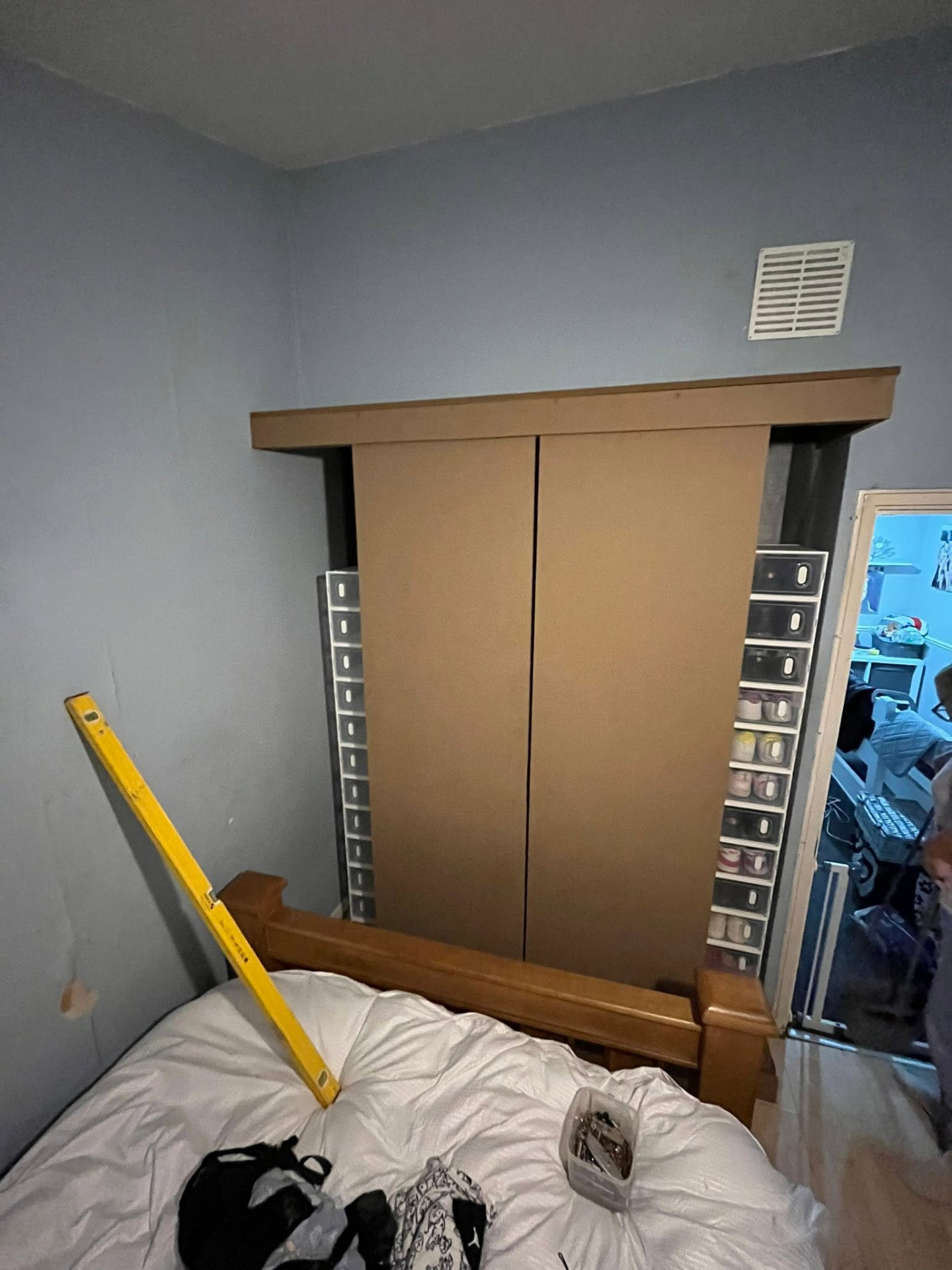 Bedroom wardrobe unit in dated oak finish before refurbishment