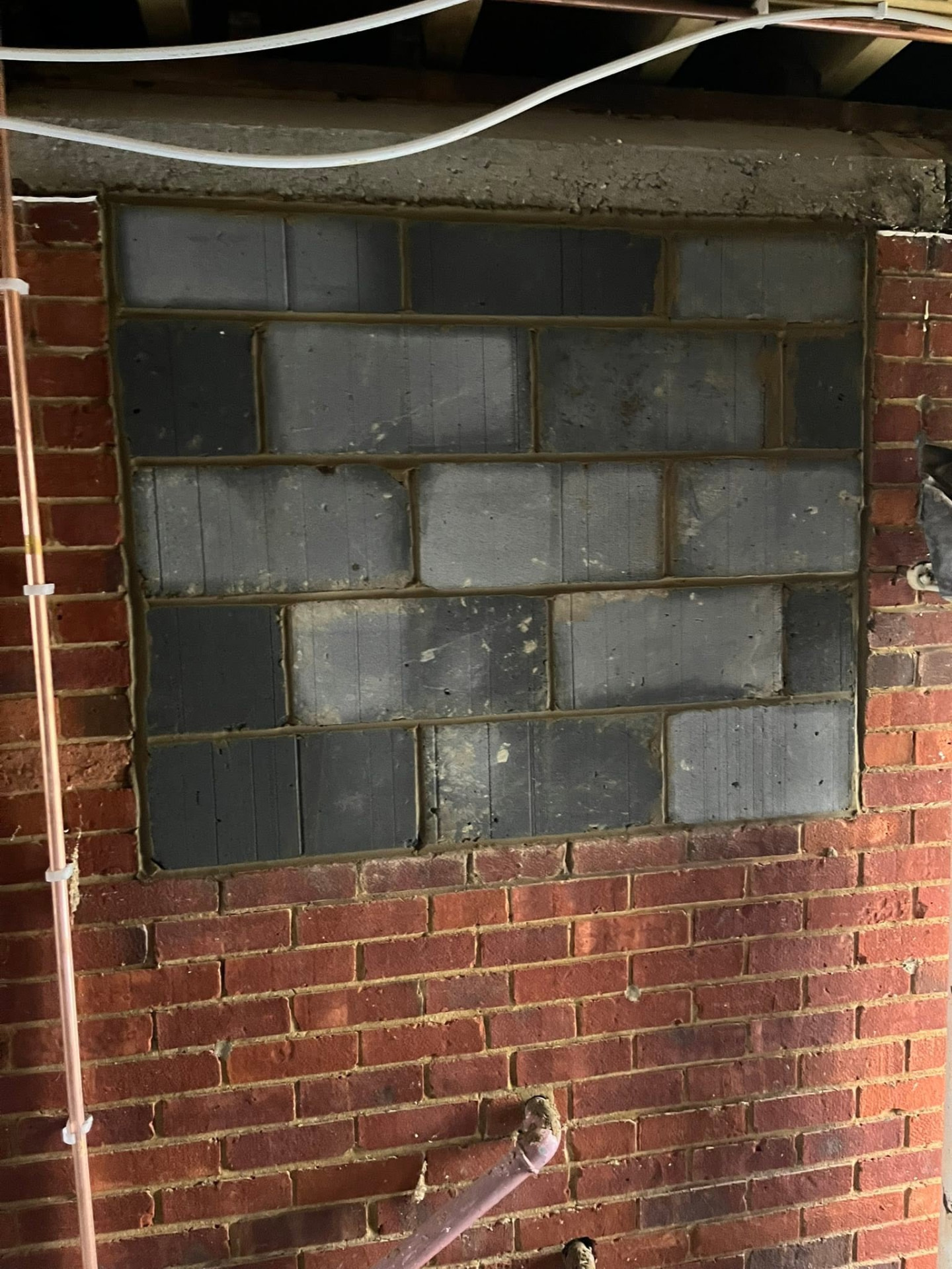 Second opening neatly infilled with fibre blocks and pointed ready for render