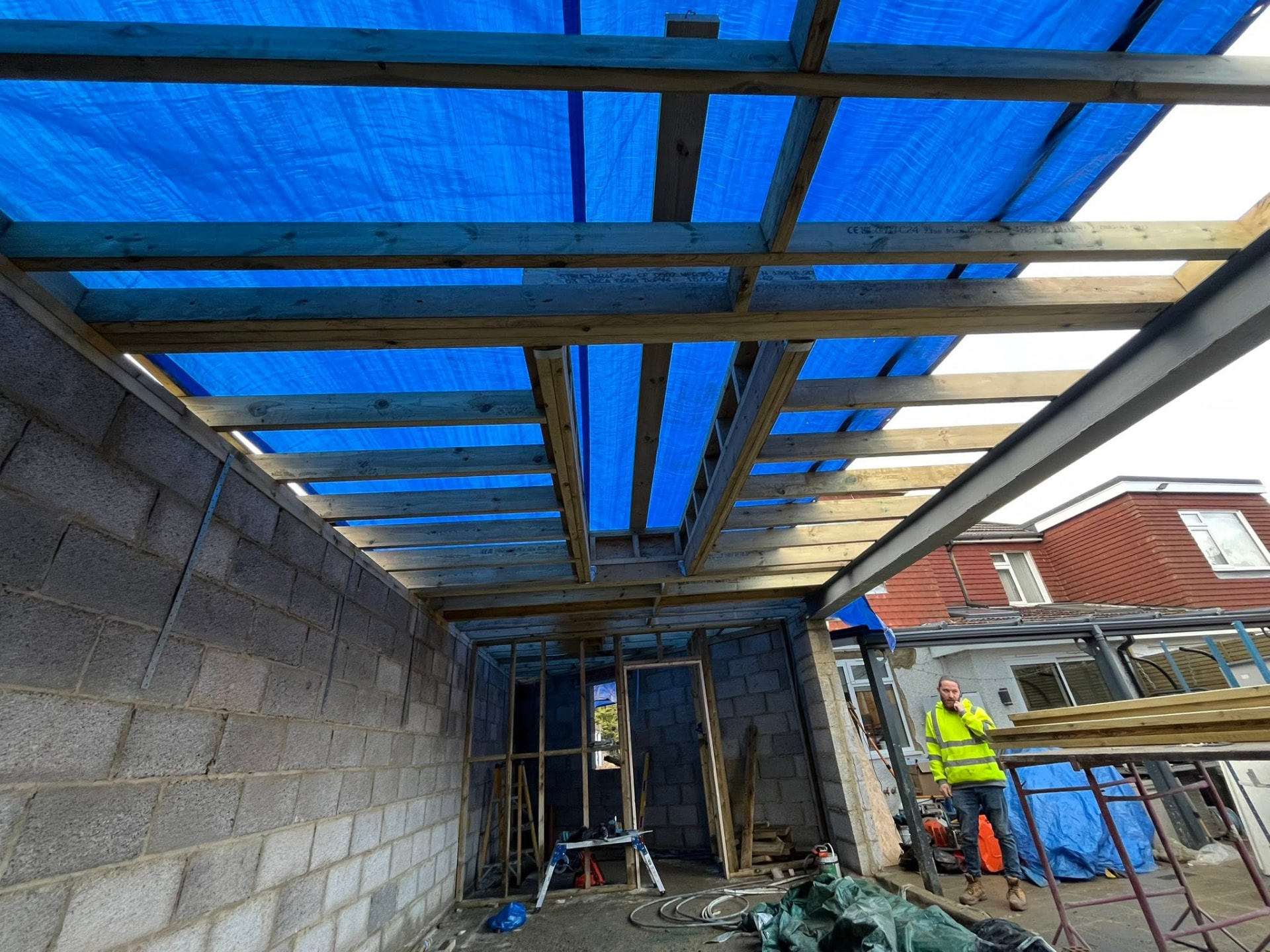 Roof structure covered over showing the steel beam and timber joists