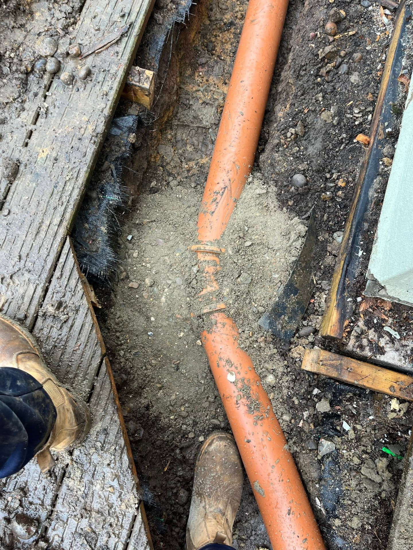 New 4-inch pipework bedded and haunched in the trench ready for backfill