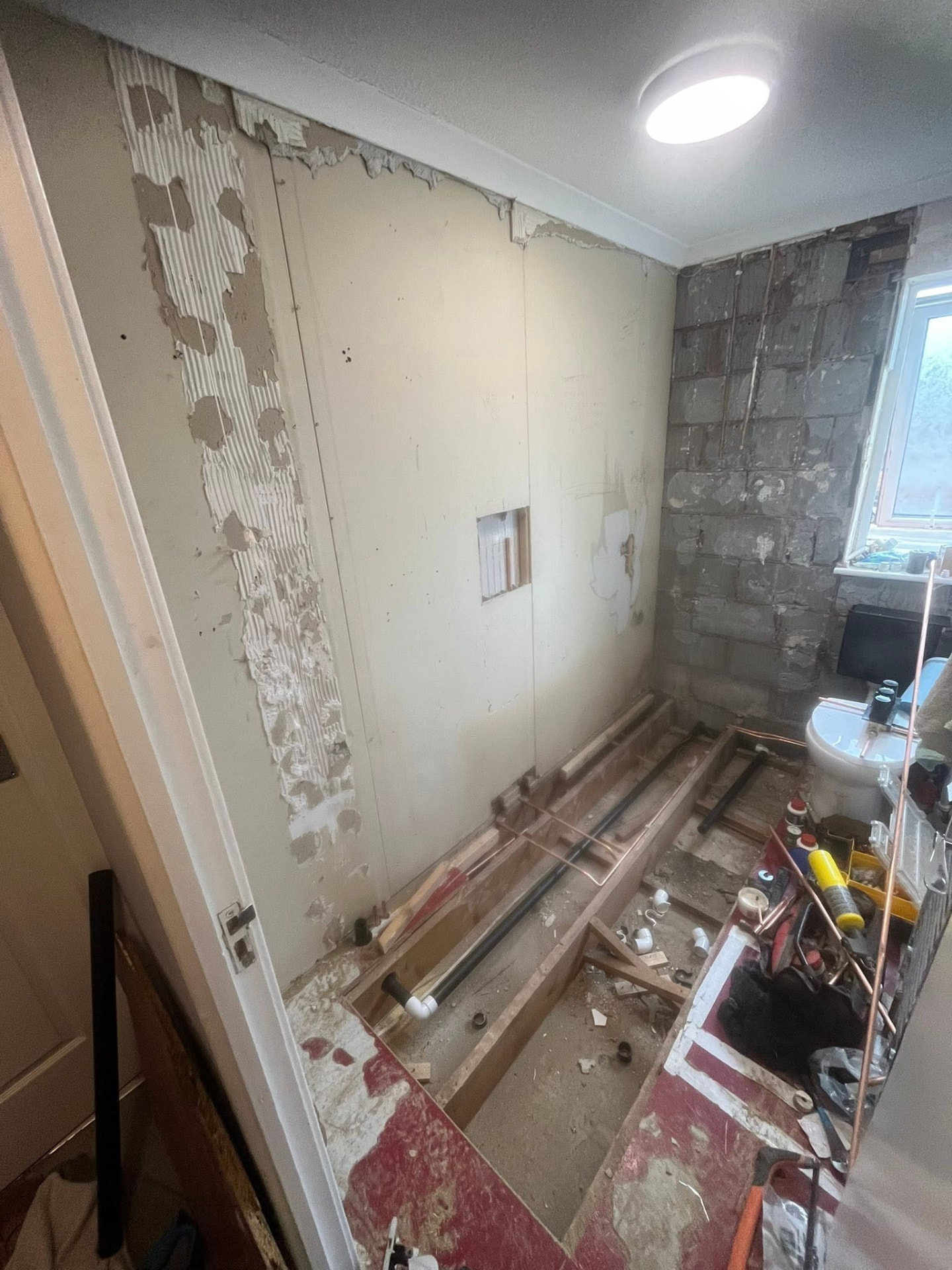 Bathroom stripped back to studwork and floor joists before refurbishment