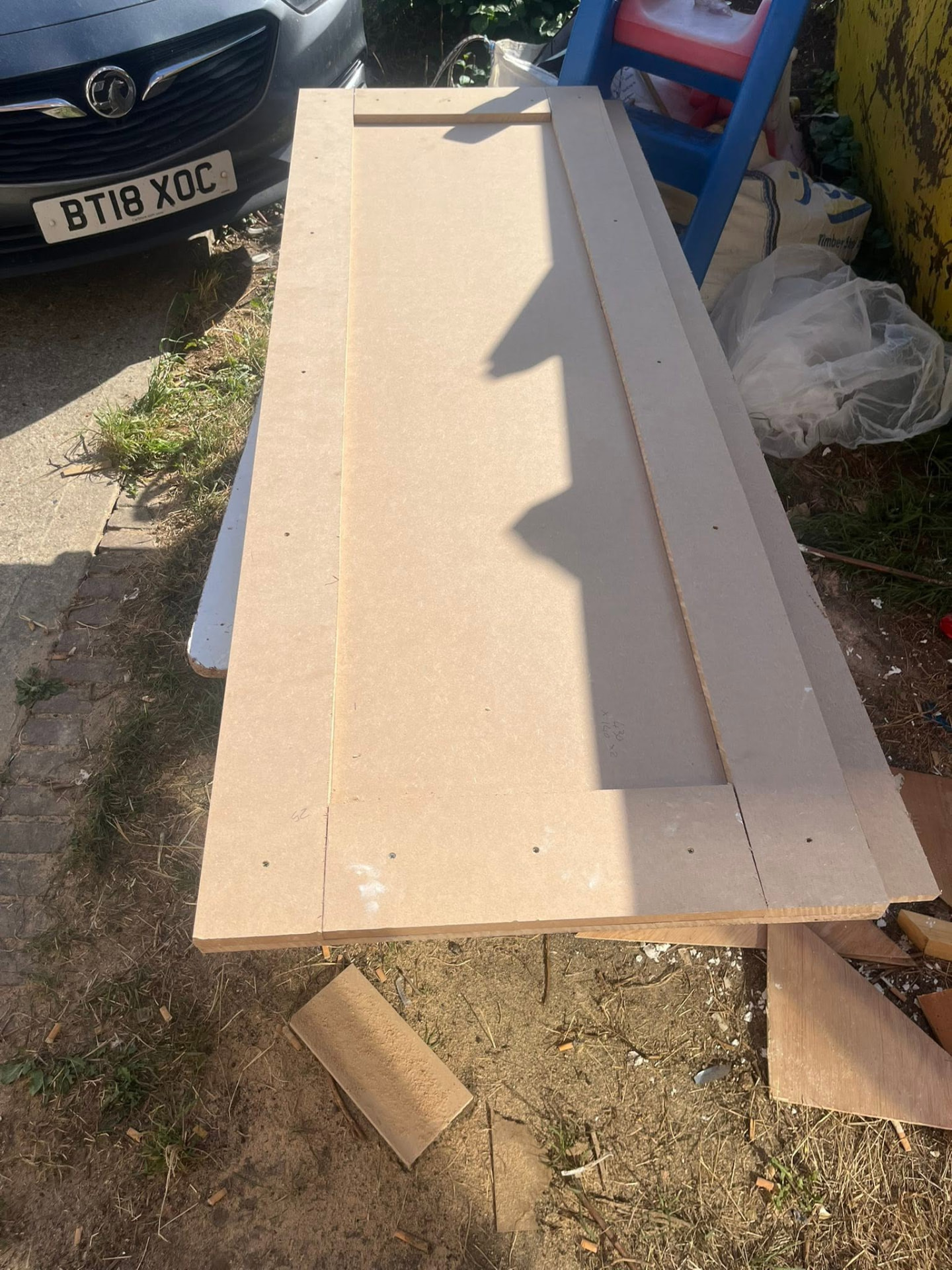 Cut MDF panels laid out for the door frames