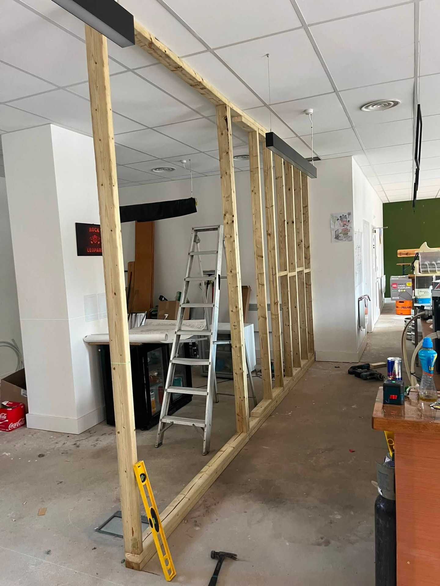 New timber stud partition frame erected and plumbed into position