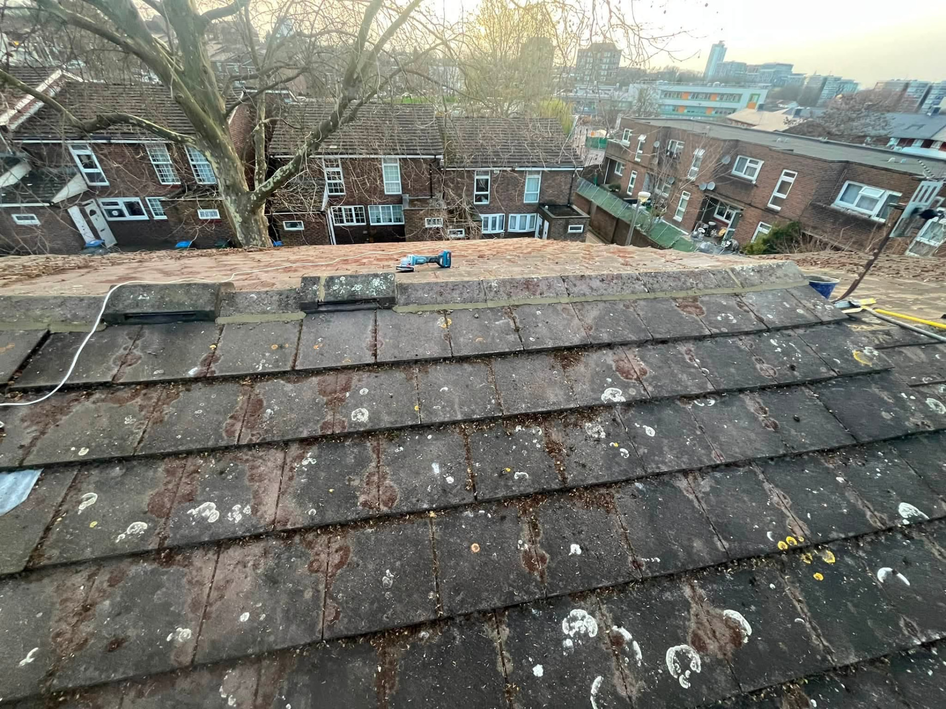 Completed roof repair with secured ridge tiles and clean tidy finish